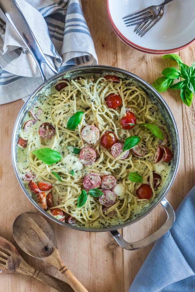 Spaghetti with Pesto Cream Sauce, Fresh Tomatoes and Mozzarella | www.oliviascuisine.com | Who can say "no" to spaghetti tossed in a delicious pesto cream sauce topped with fresh cherry tomatoes and mozzarella balls? Not me! Especially when it's so easy to make and on the table in 15 minutes!