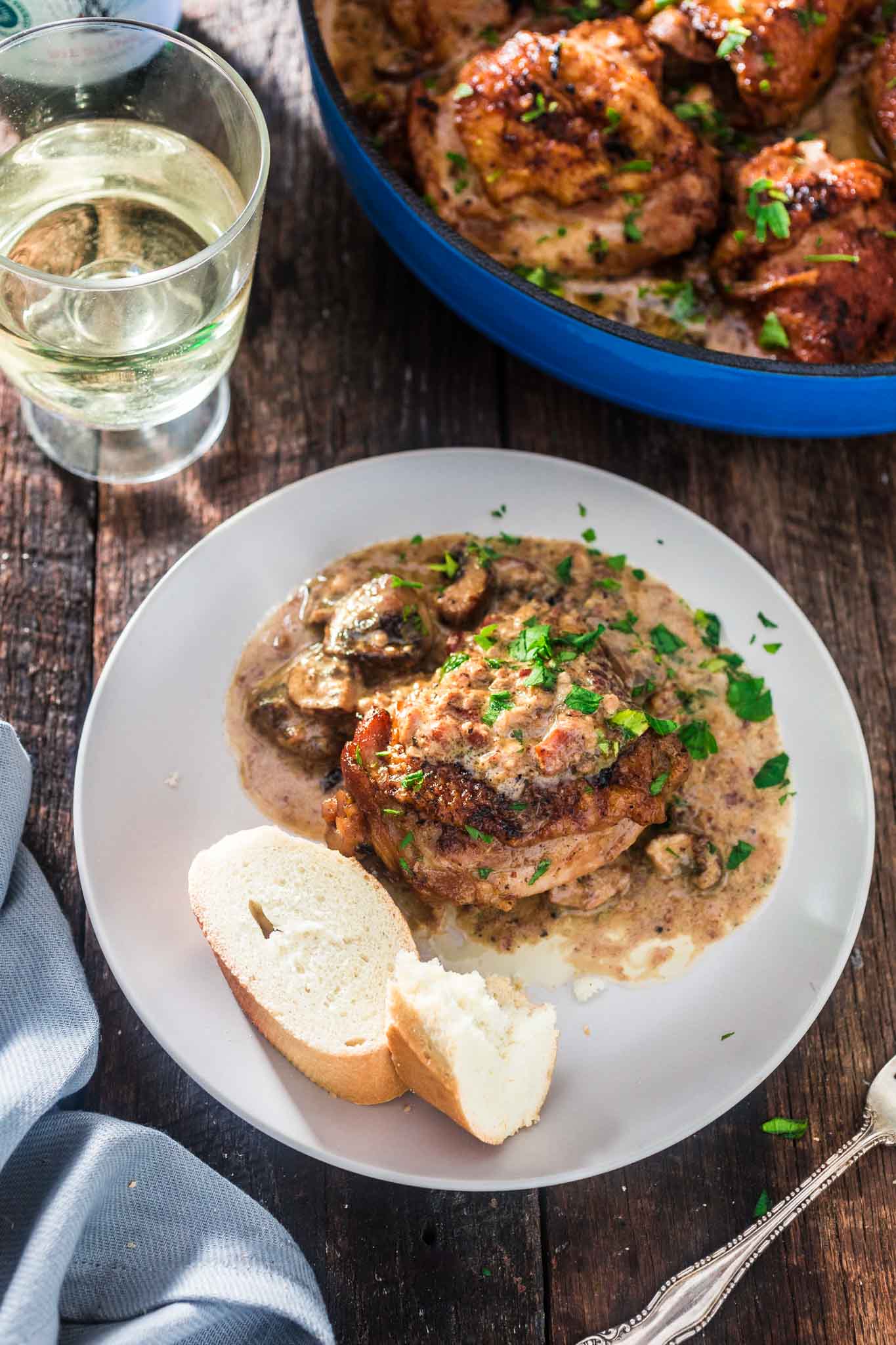 Coq au Riesling (Chicken Thighs Braised in White Wine) | www.oliviascuisine.com | A creamy twist on the classic Coq au Vin. Chicken thighs, bacon and mushrooms are braised in an off-dry Riesling and heavy cream is added at the end to make it even more delicious! Oh, and it's all made in one pot! (Sponsored by @theseekerwines)