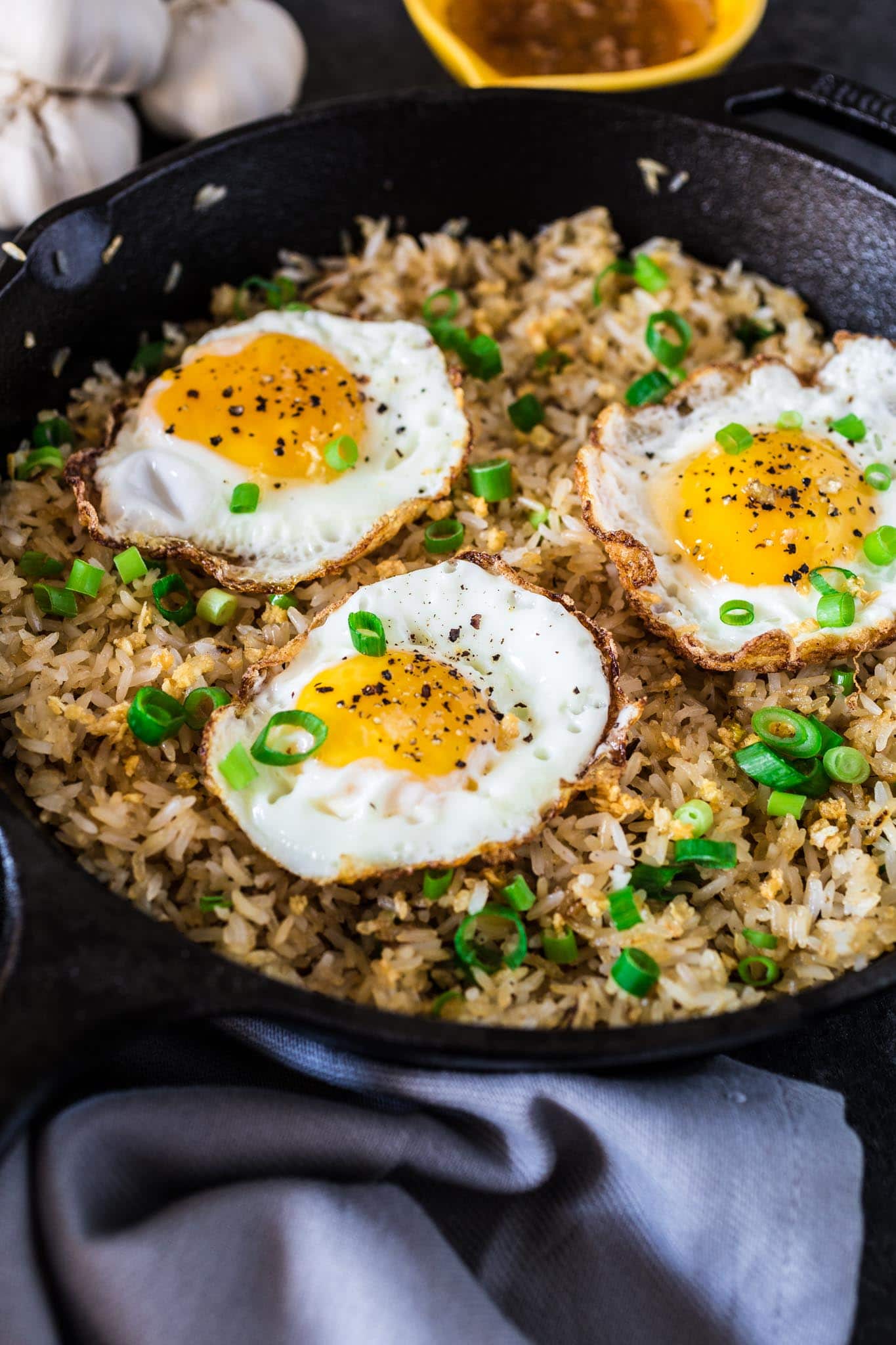 Filipino Garlic Fried Rice | www.oliviascuisine.com | Sinangag, or Garlic Fried Rice, is a popular Filipino breakfast, often served with a fried egg on top and a drizzle of vinegar sauce. Don't have a stomach for rice and garlic in the morning? No problem! This dish is also amazing for lunch or as a side for dinner.