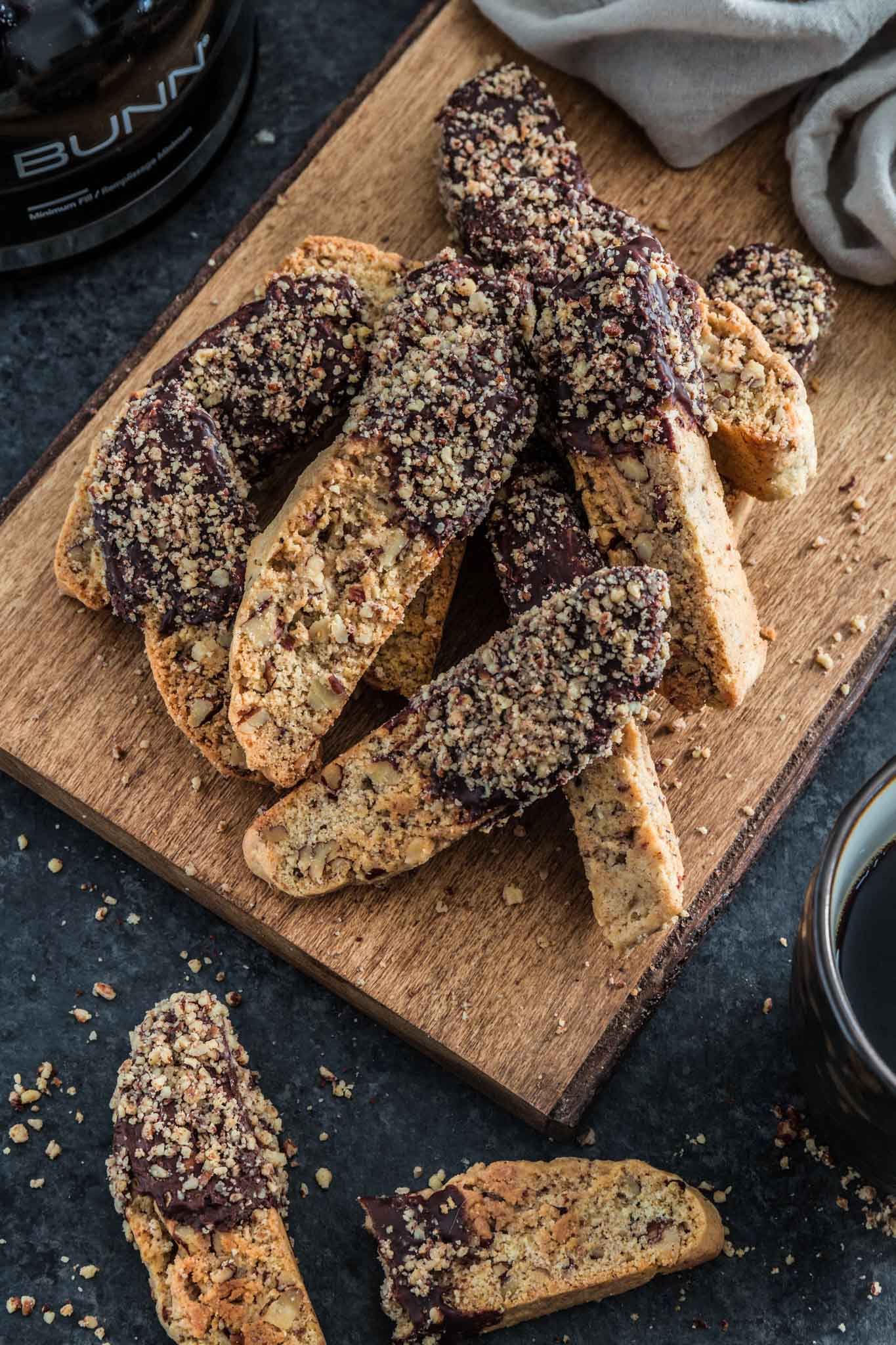 Chocolate Dipped Cinnamon Pecan Biscotti | www.oliviascuisine.com | Lighter than Italian biscotti, these Chocolate Dipped Cinnamon Pecan Biscotti are crisp, tender and filled with some of my favorite holiday noms: cinnamon, pecan and chocolate! Perfect to give out as holiday gifts or just to dunk into your coffee. 