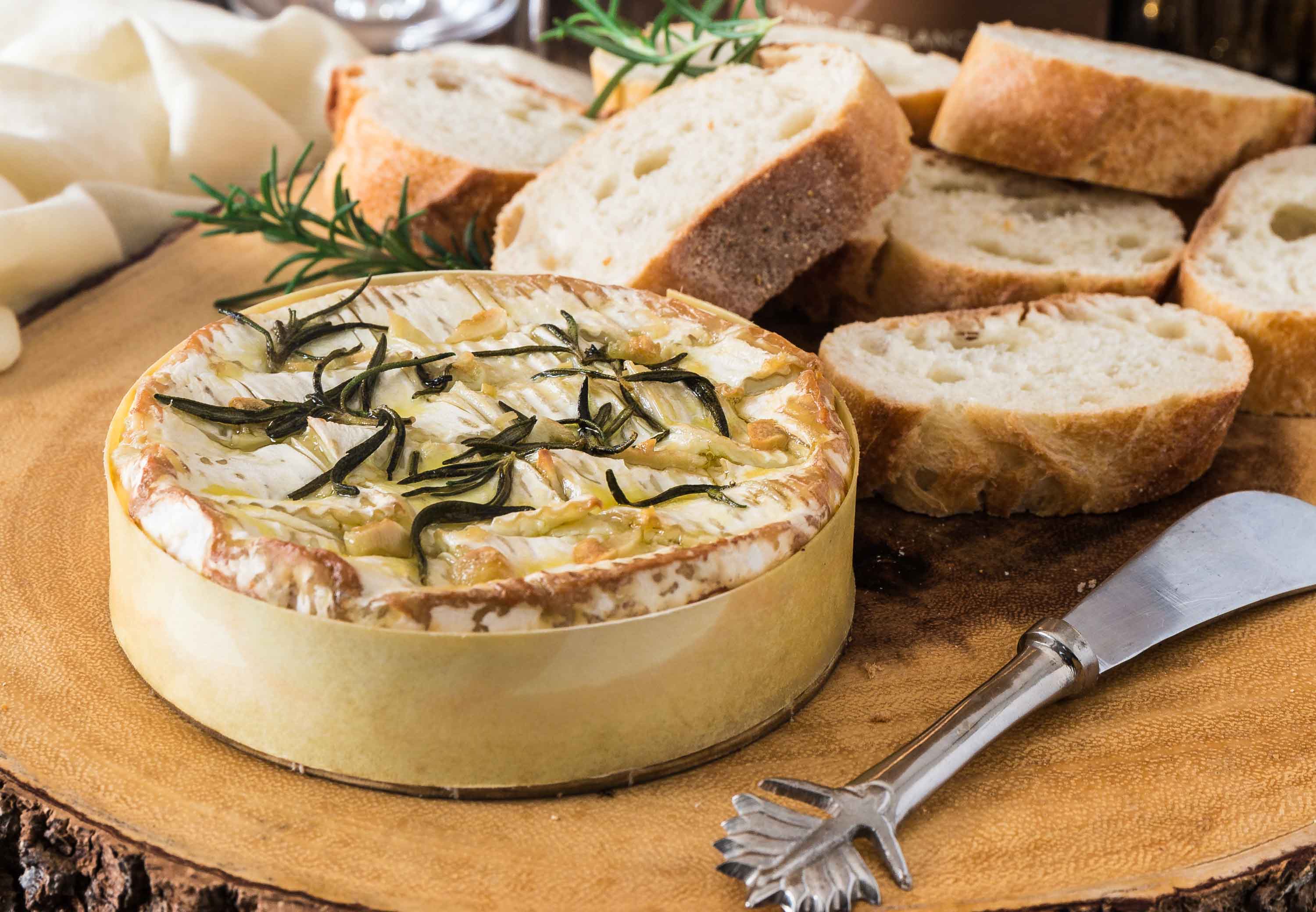 Baked Camembert with Garlic and Rosemary | www.oliviascuisine.com | A gooey and fragrant Baked Camembert is always a must at my dinner parties. This version with garlic and rosemary is one of my favorites and pairs greatly with a glass of bubbly!