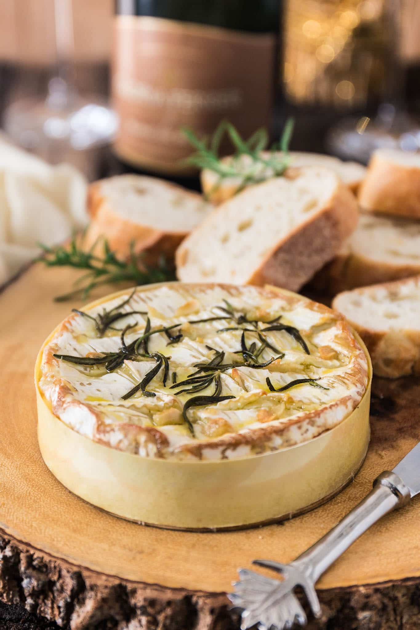 Baked Camembert with Garlic and Rosemary | www.oliviascuisine.com | A gooey and fragrant Baked Camembert is always a must at my dinner parties. This version with garlic and rosemary is one of my favorites and pairs greatly with a glass of bubbly!