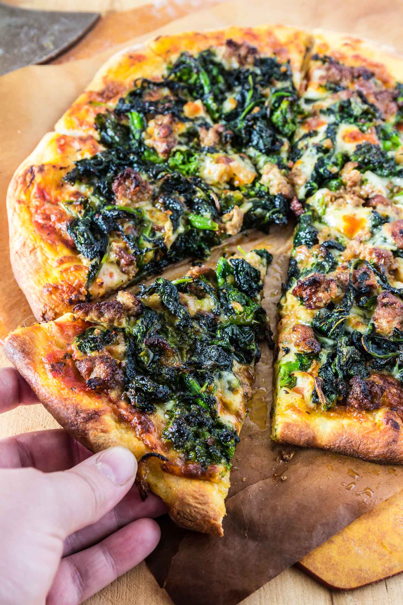 Turkey Sausage and Broccoli Rabe Pizza | www.oliviascuisine.com | This Turkey Sausage and Broccoli Rabe Pizza is one of the best pizzas you will ever taste. The slightly bitter and peppery broccoli rabe combined with the smokiness of the provolone cheese and the subtle sweetness from the turkey sausage create an explosion of flavor that will wow even those who turn their noses at broccoli rabe. You simply must try this! (Recipe by @oliviascuisine).