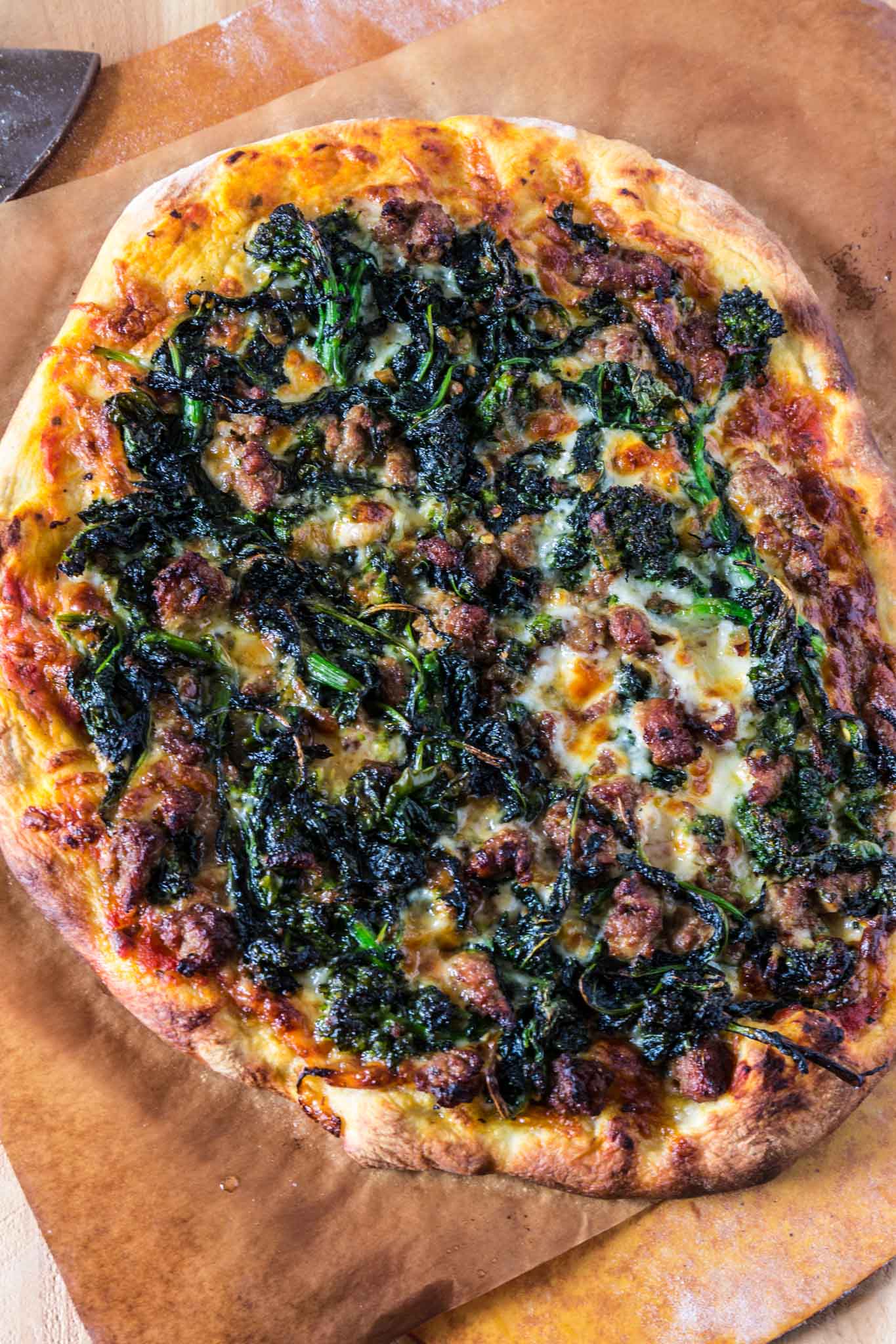Turkey Sausage and Broccoli Rabe Pizza | www.oliviascuisine.com | This Turkey Sausage and Broccoli Rabe Pizza is one of the best pizzas you will ever taste. The slightly bitter and peppery broccoli rabe combined with the smokiness of the provolone cheese and the subtle sweetness from the turkey sausage create an explosion of flavor that will wow even those who turn their noses at broccoli rabe. You simply must try this! (Recipe by @oliviascuisine).