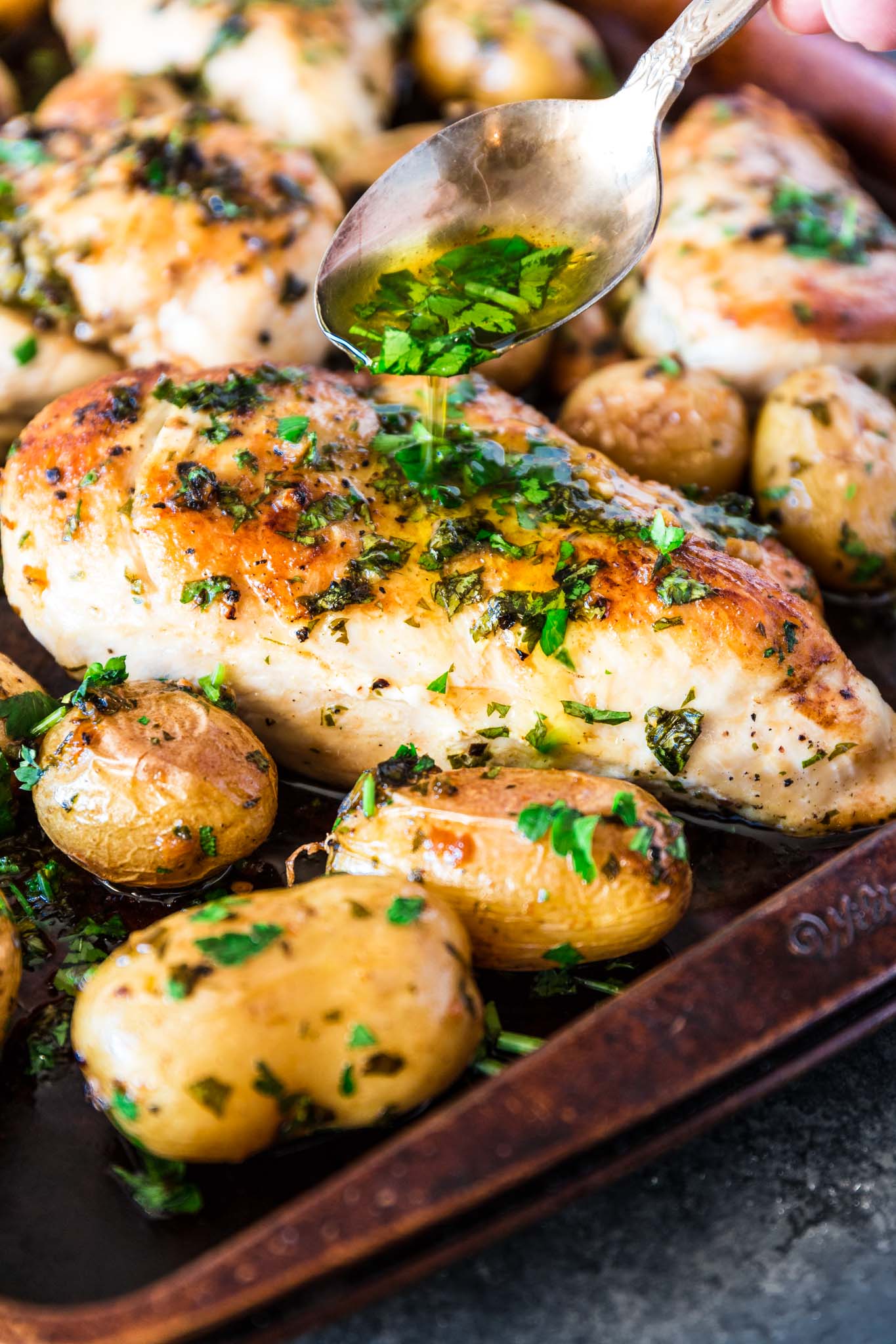 Sheet Pan Chicken with Spicy Potatoes (Batata Harra) | www.oliviascuisine.com | The easiest meal ever consists of juicy and perfectly seasoned chicken breasts served with batata harra, baked Lebanese spicy potatoes that melt in your mouth while enticing your tastebuds. (Recipe by @oliviascuisine.)