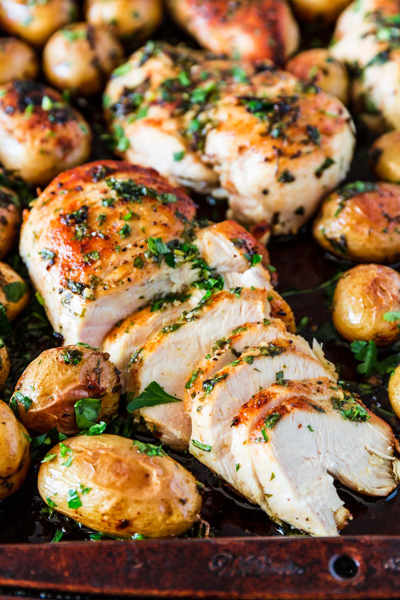 Sheet Pan Chicken with Spicy Potatoes (Batata Harra) | www.oliviascuisine.com | The easiest meal ever consists of juicy and perfectly seasoned chicken breasts served with batata harra, baked Lebanese spicy potatoes that melt in your mouth while enticing your tastebuds. (Recipe by @oliviascuisine.)