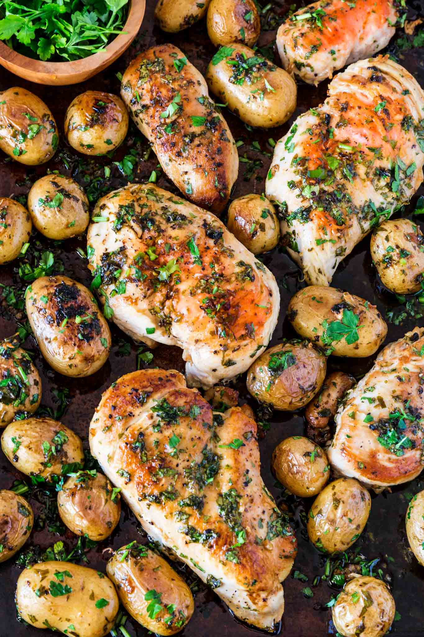 Sheet Pan Chicken with Spicy Potatoes (Batata Harra) | www.oliviascuisine.com | The easiest meal ever consists of juicy and perfectly seasoned chicken breasts served with batata harra, baked Lebanese spicy potatoes that melt in your mouth while enticing your tastebuds. (Recipe by @oliviascuisine.)