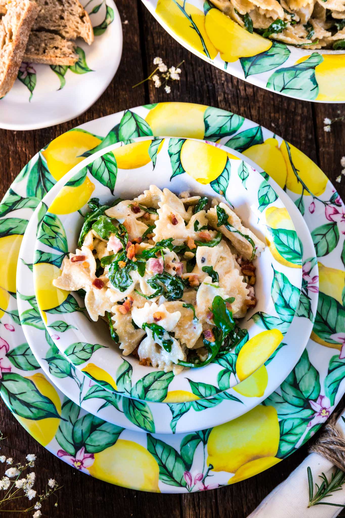 Farfalle with Pancetta, Arugula and Lemon Cream Sauce | www.oliviascuisine.com | A pasta dish that embodies all the things we love about spring and summer. Fresh, colorful and tied together with a lip smacking lemon cream sauce that is to die for! Featuring the beautiful Q Squared NYC's Limonata Collection. (Recipe by @oliviascuisine.)