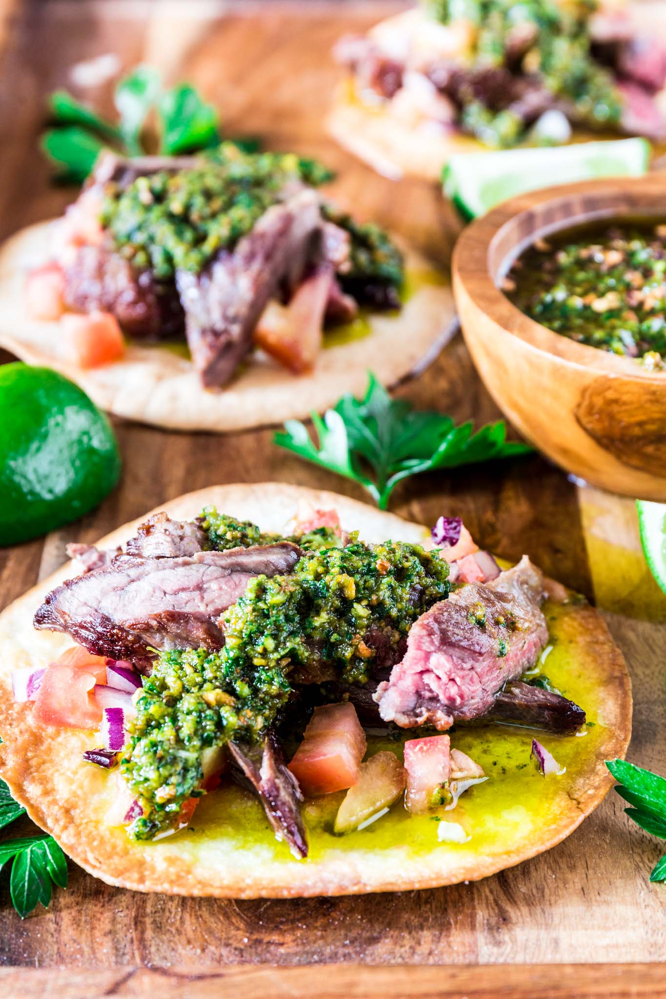 Carne Asada Tostadas with Pistachio Chimichurri | www.oliviascuisine.com | Get in the mood for Cinco de Mayo with these Carne Asada Tostadas served with a delicious pistachio chimichurri sauce. Crunchy, juicy, nutty and beyond irresistible! Trust me, you'll be hooked. (Recipe by @oliviascuisine.)