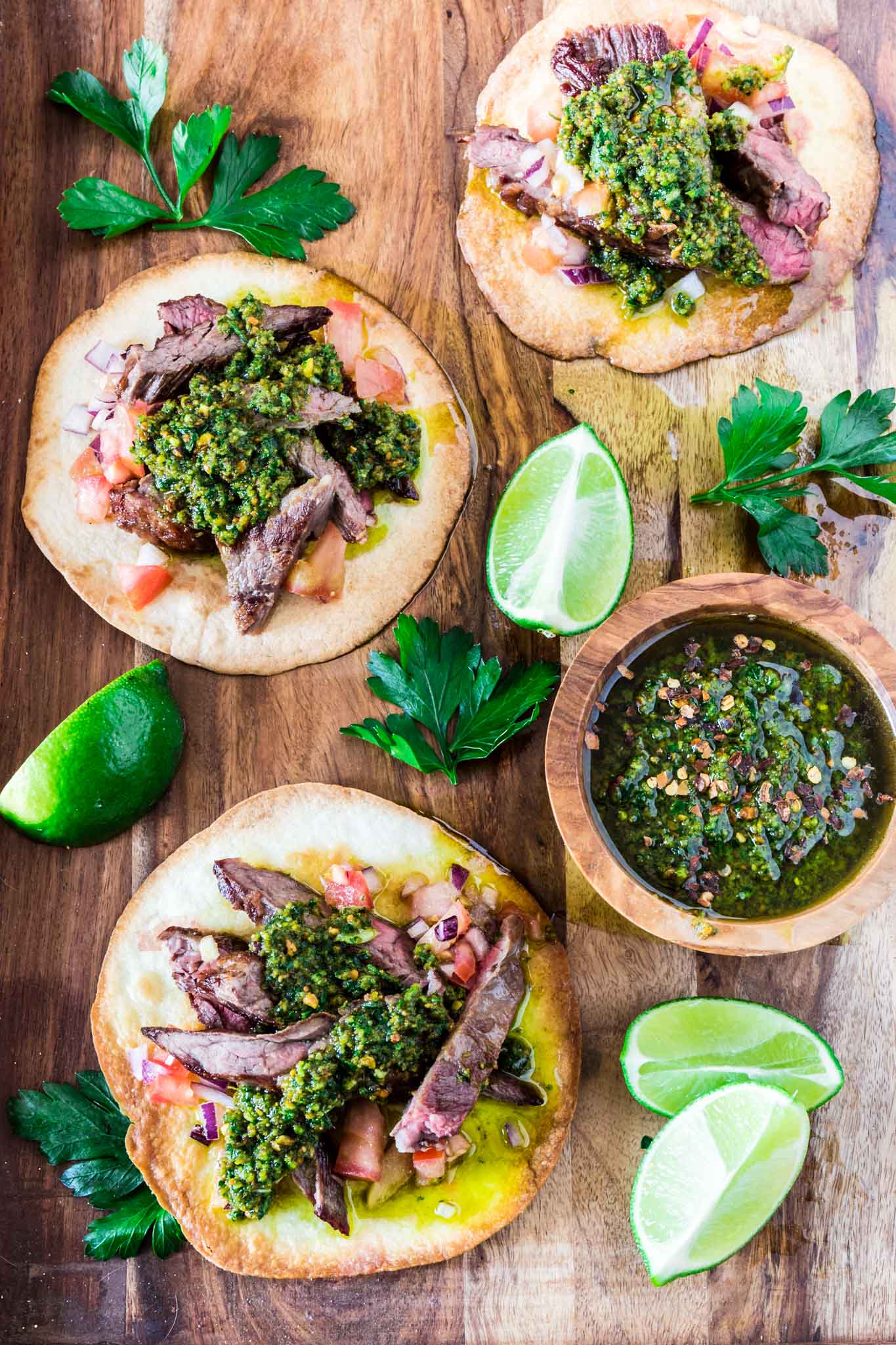 Carne Asada Tostadas with Pistachio Chimichurri | www.oliviascuisine.com | Get in the mood for Cinco de Mayo with these Carne Asada Tostadas served with a delicious pistachio chimichurri sauce. Crunchy, juicy, nutty and beyond irresistible! Trust me, you'll be hooked. (Recipe by @oliviascuisine.)