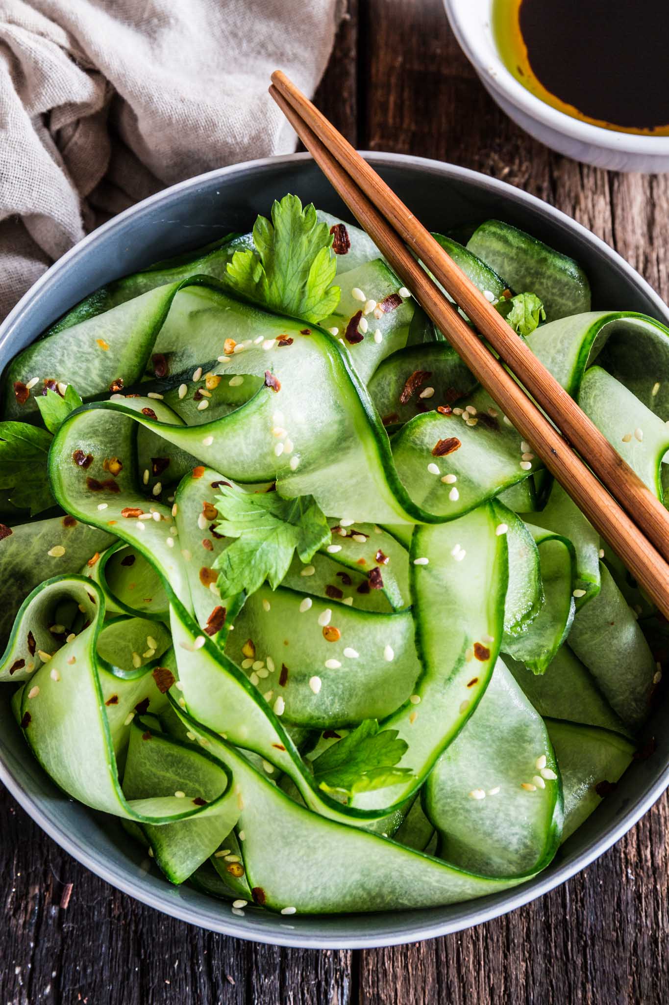 Thai Cucumber Salad with Sesame Ginger Dressing | www.oliviascuisine.com | Some of the best pleasures in life are the simple ones, like this refreshing and light Thai Cucumber Salad. It comes together in less than 5 minutes, so you won't have to miss any second of that sacred summer sunshine! (Recipe by @oliviascuisine.)