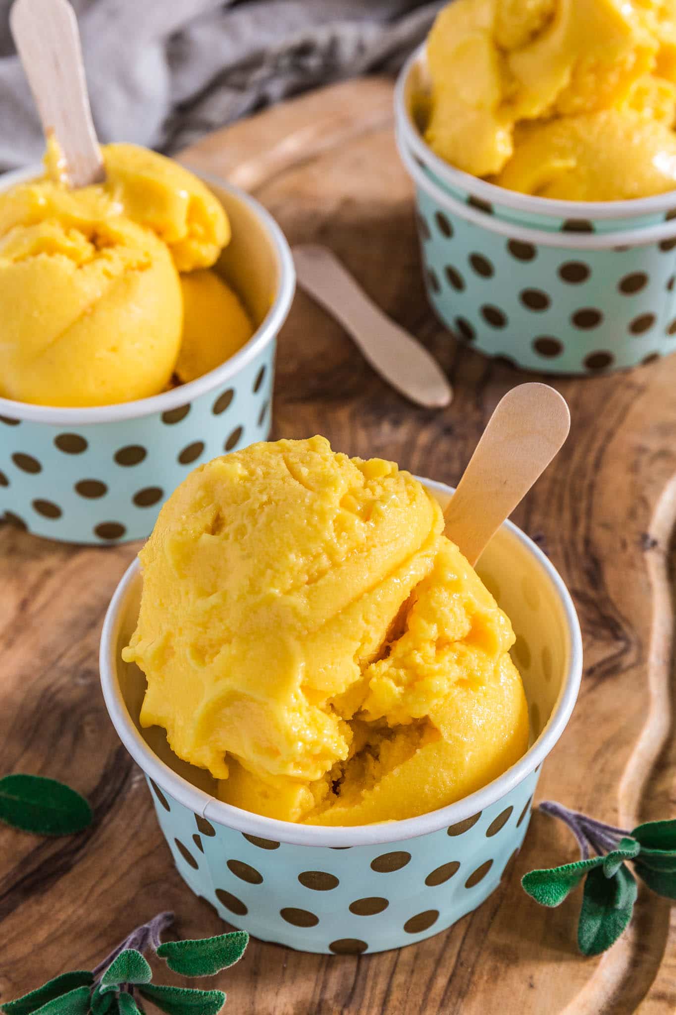 Mango Frozen Yogurt | www.oliviascuisine.com | Luscious, creamy and tangy, this Mango Frozen Yogurt is everything you need on a hot summer day! And the best part? No ice cream machine necessary! (Recipe by @oliviascuisine.)