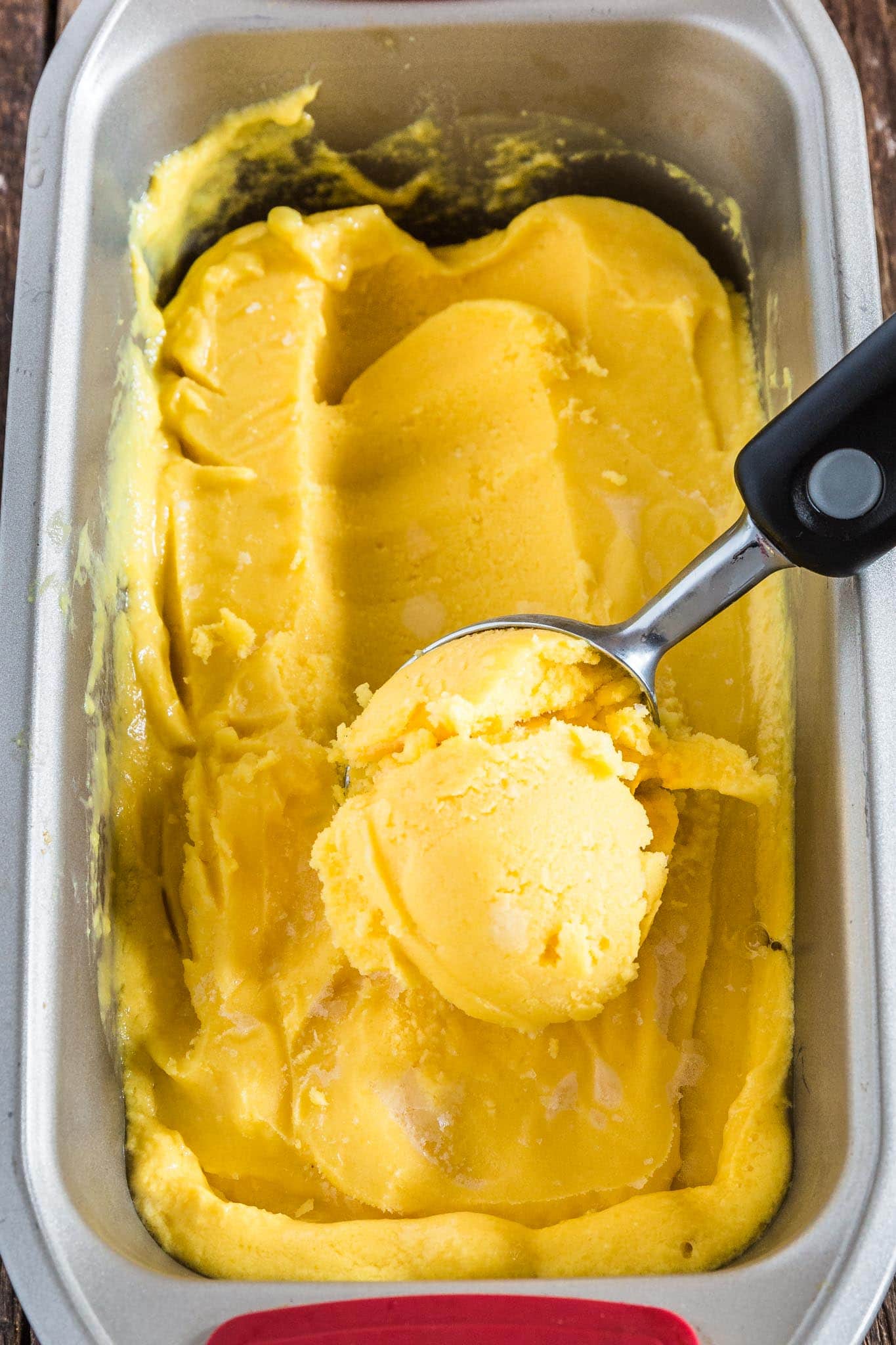 Mango Frozen Yogurt | www.oliviascuisine.com | Luscious, creamy and tangy, this Mango Frozen Yogurt is everything you need on a hot summer day! And the best part? No ice cream machine necessary! (Recipe by @oliviascuisine.)