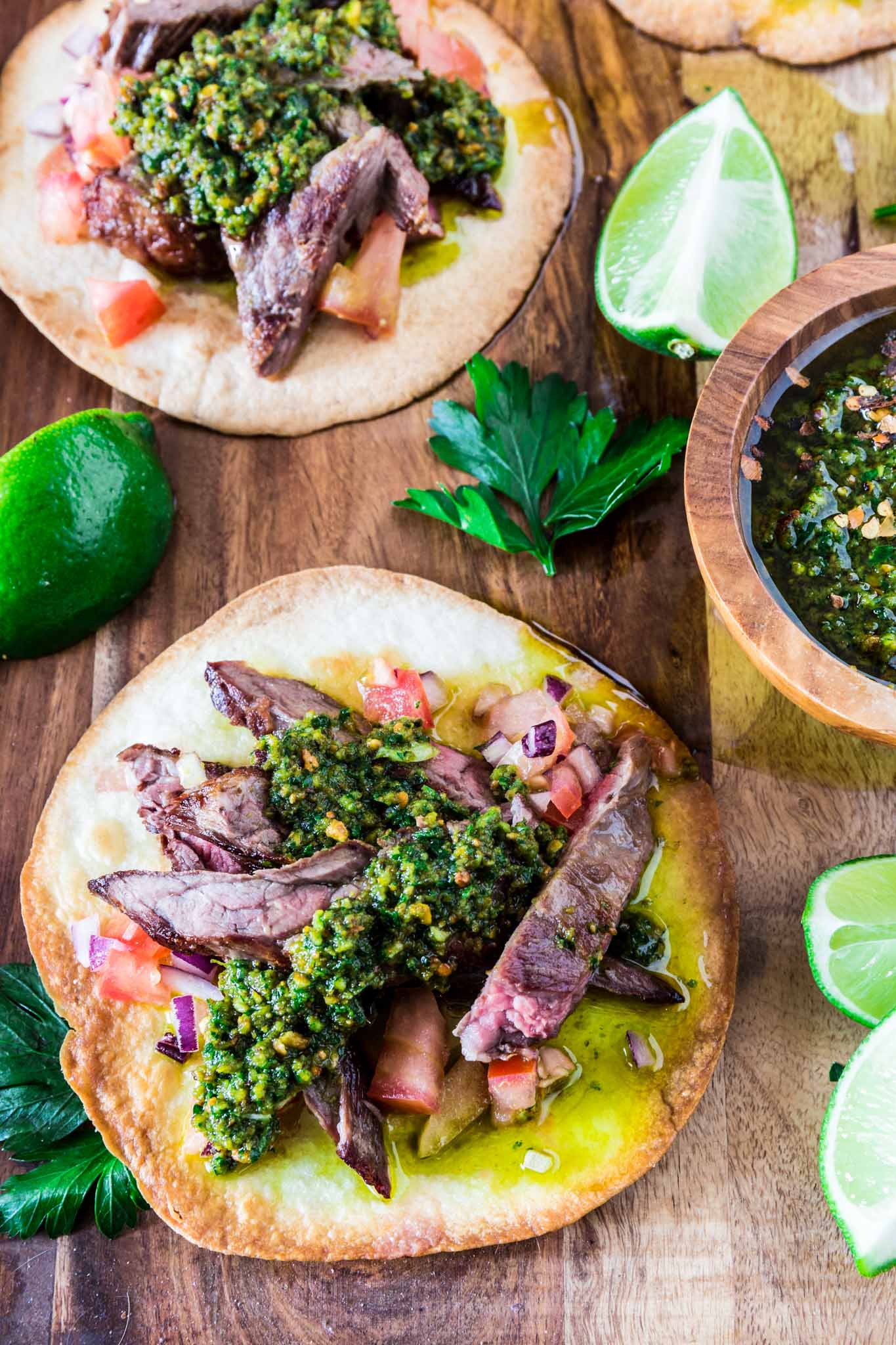 Carne Asada Tostadas with Pistachio Chimichurri | www.oliviascuisine.com | Get in the mood for Cinco de Mayo with these Carne Asada Tostadas served with a delicious pistachio chimichurri sauce. Crunchy, juicy, nutty and beyond irresistible! Trust me, you'll be hooked. (Recipe by @oliviascuisine.)