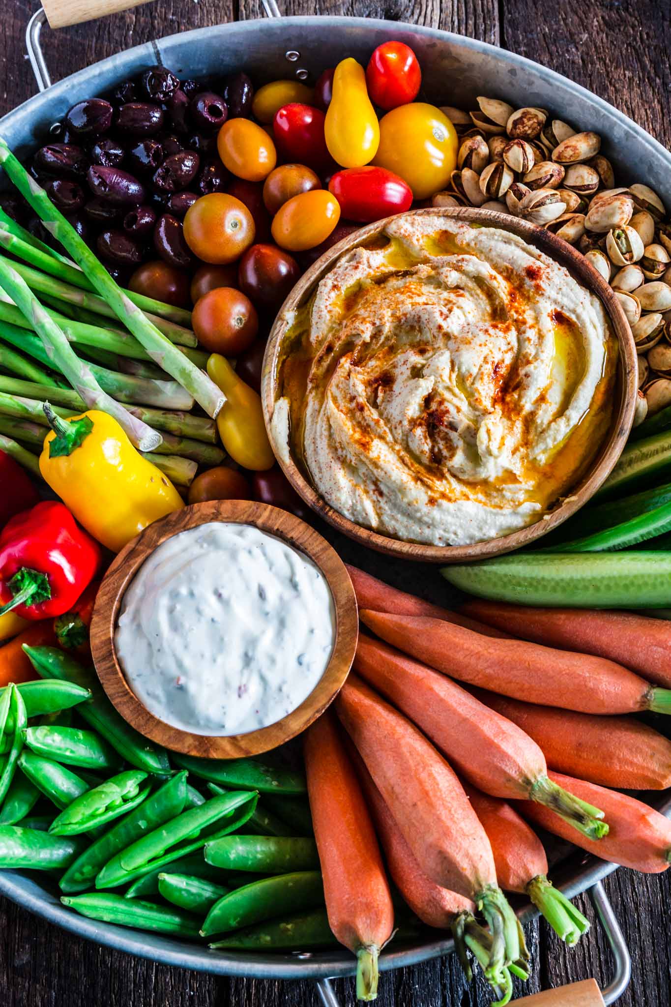 How to Assemble a Crudité Platter | www.oliviascuisine.com | Learn how to set up a Crudité Platter that your guests will actually enjoy, filled with fresh and seasonal veggies and a few delicious dips, olives and nuts. Follow this quick guide and I guarantee you will find even the pickiest of eaters hanging around this awesome vegetable tray! (Recipe and photos by @oliviascuisine)