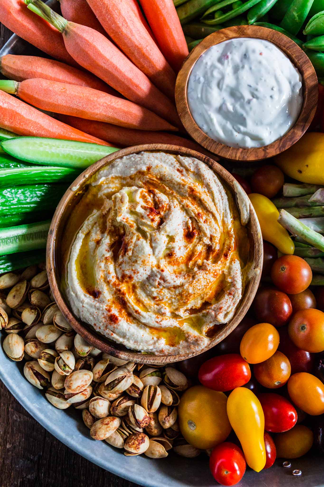 How to Assemble a Crudité Platter | www.oliviascuisine.com | Learn how to set up a Crudité Platter that your guests will actually enjoy, filled with fresh and seasonal veggies and a few delicious dips, olives and nuts. Follow this quick guide and I guarantee you will find even the pickiest of eaters hanging around this awesome vegetable tray! (Recipe and photos by @oliviascuisine)