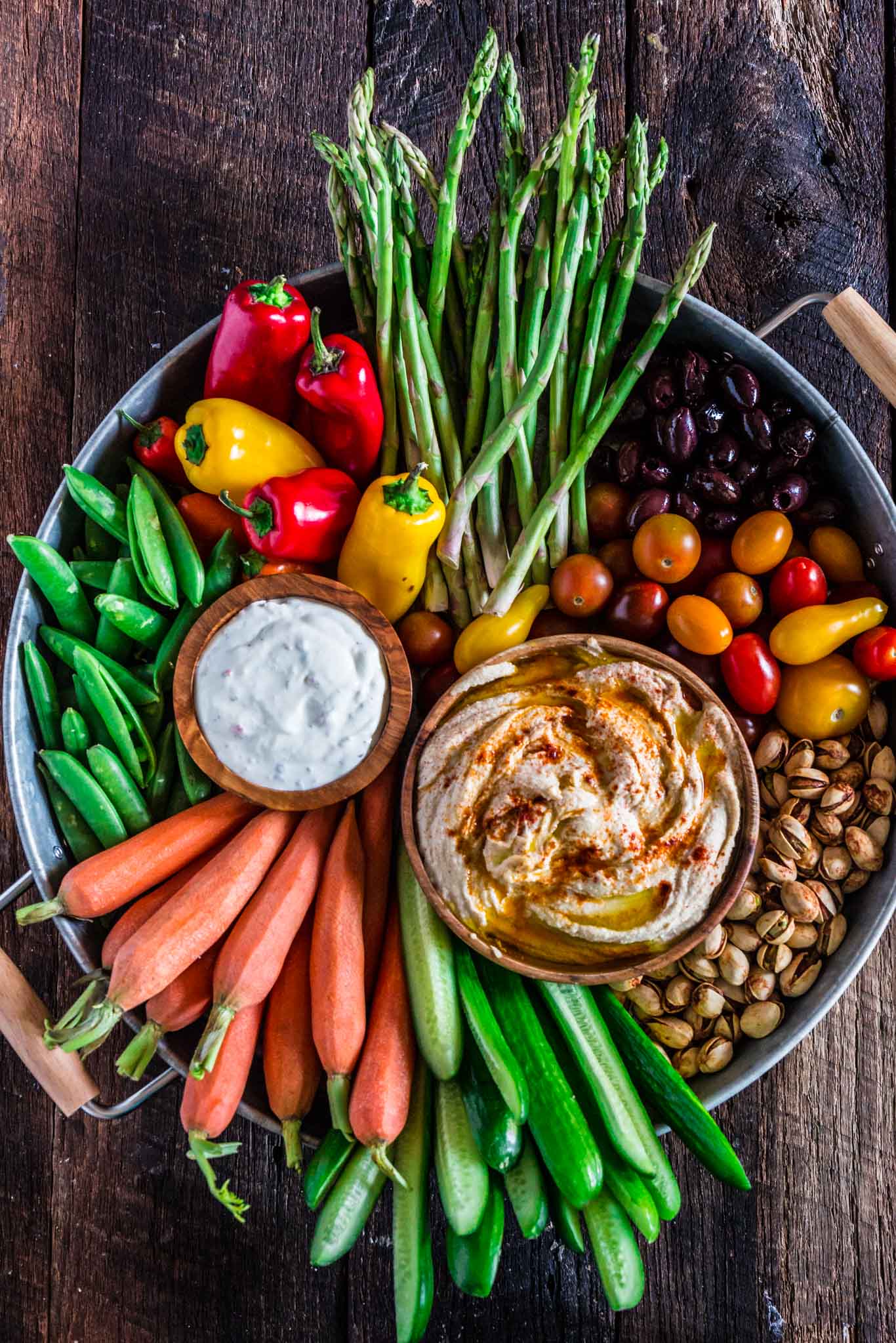 How to Assemble a Crudité Platter | www.oliviascuisine.com | Learn how to set up a Crudité Platter that your guests will actually enjoy, filled with fresh and seasonal veggies and a few delicious dips, olives and nuts. Follow this quick guide and I guarantee you will find even the pickiest of eaters hanging around this awesome vegetable tray! (Recipe and photos by @oliviascuisine)