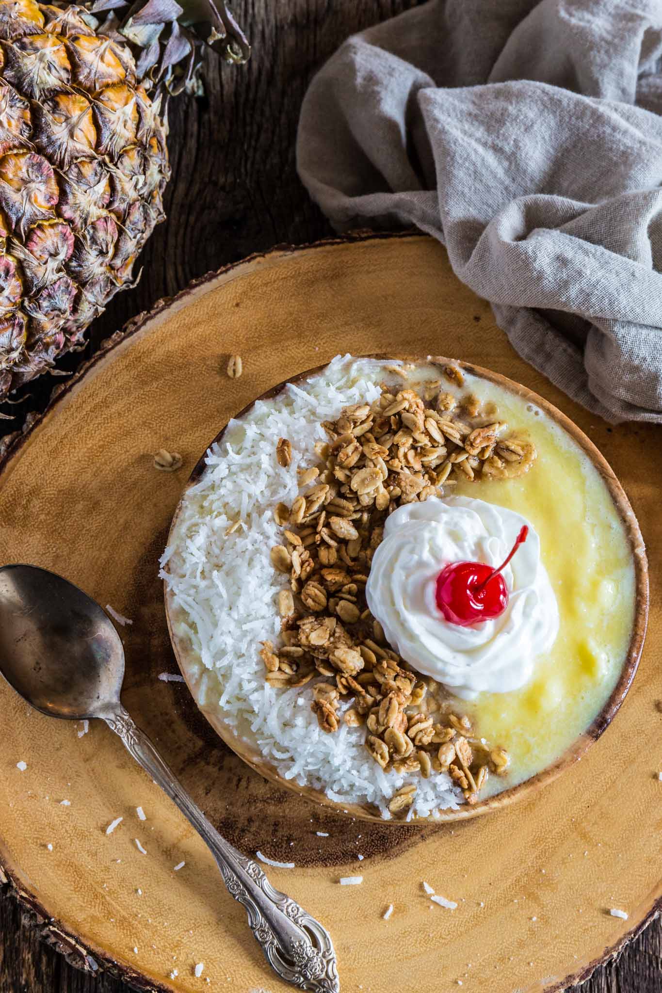 Pina Colada Smoothie Bowl | www.oliviascuisine.com | Can't escape to a beach somewhere at the moment? No problem! Make this Pina Colada Smoothie Bowl and you'll feel like you're in a tropical paradise. (Recipe and food photography by @oliviascuisine.)