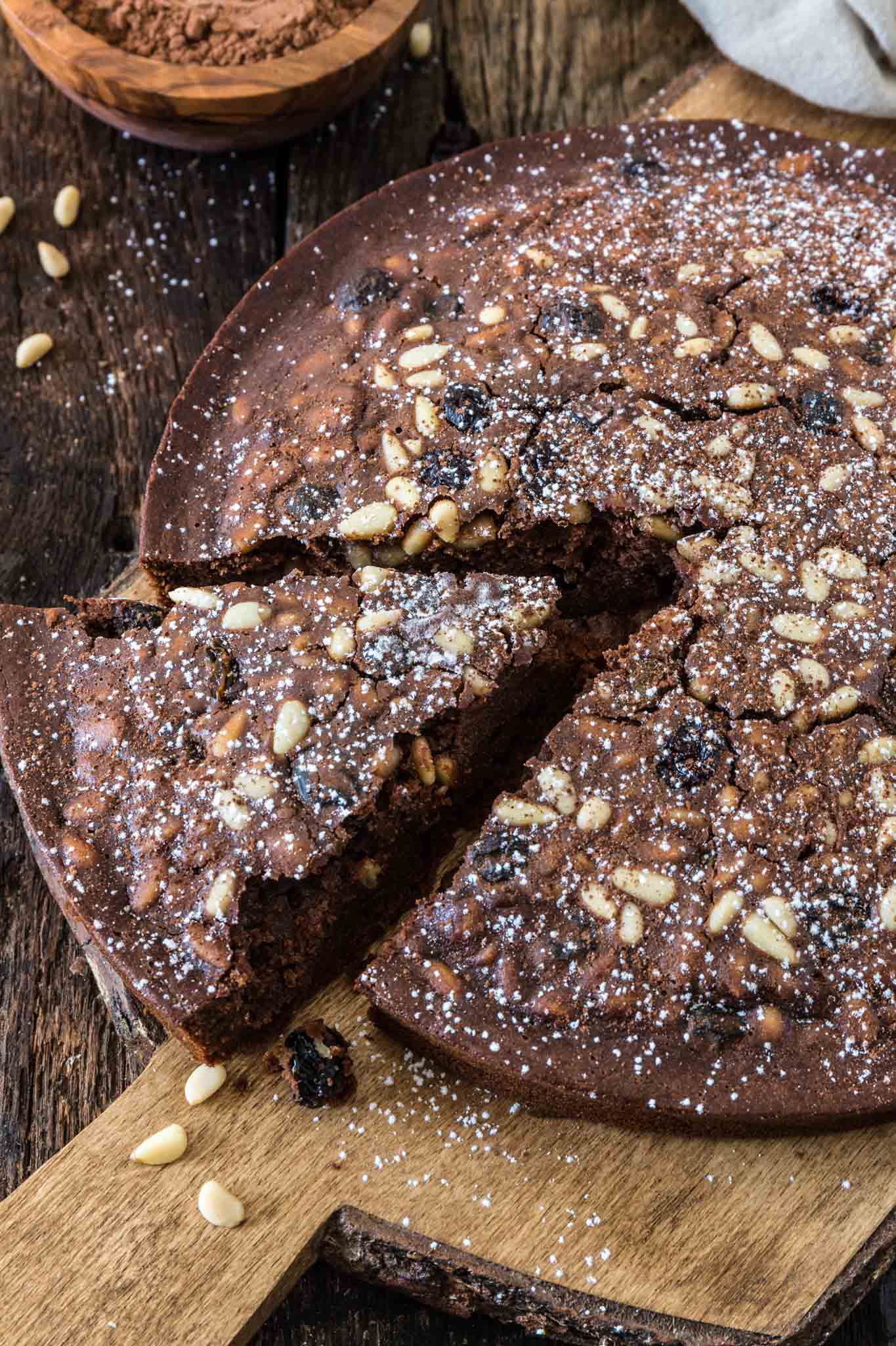 Castagnaccio Pugliese (Chestnut Flour Cake) | www.oliviascuisine.com | An Italian autumnal classic, the Castagnaccio is a gluten-free cake made of chestnut flour, olive oil, dried fruits and nuts. Served with a cup of espresso (or wine) and a drizzle of honey, it is the perfect treat on a cold afternoon.