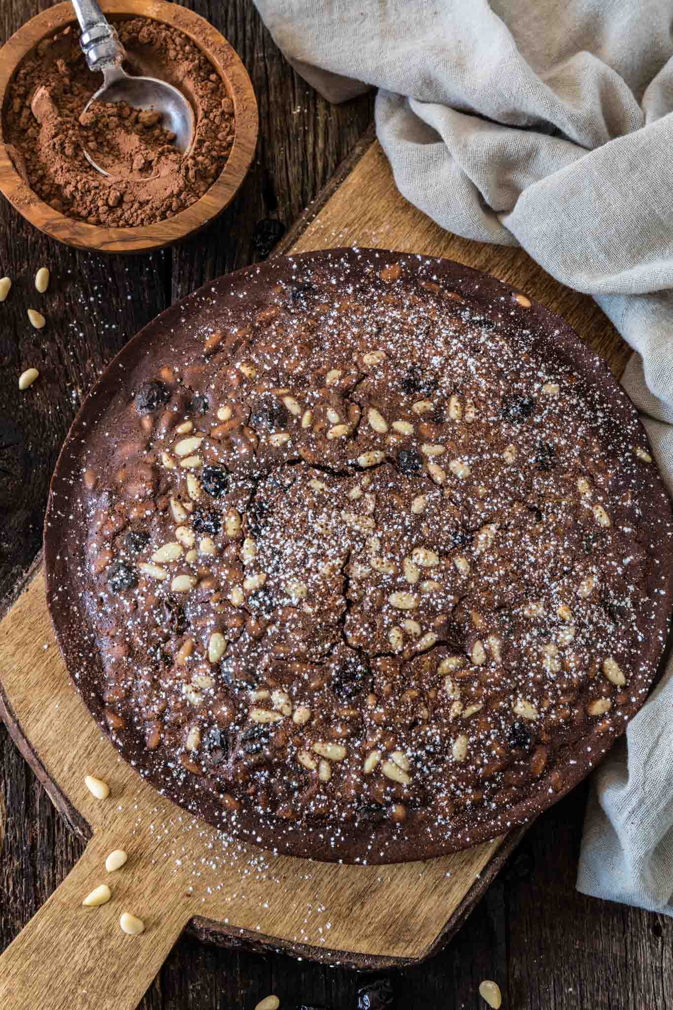 Castagnaccio Pugliese (Chestnut Flour Cake) | www.oliviascuisine.com | An Italian autumnal classic, the Castagnaccio is a gluten-free cake made of chestnut flour, olive oil, dried fruits and nuts. Served with a cup of espresso (or wine) and a drizzle of honey, it is the perfect treat on a cold afternoon.