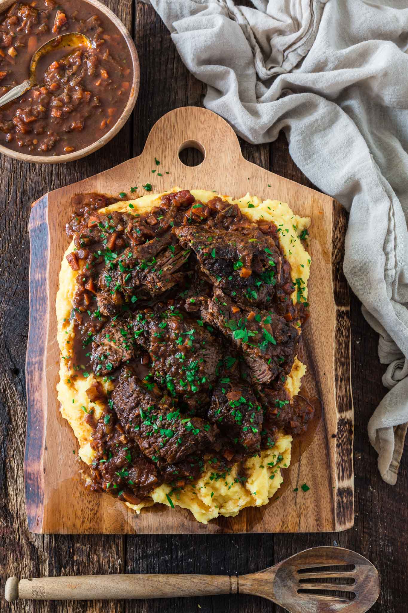 Italian Pot Roast (Stracotto alla Fiorentina) | www.oliviascuisine.com | Cold weather calls for comfort food, like this hearty and cozy Italian Pot Roast. It is made Tuscan style, simmering for hours in a delicious tomato sauce to ensure deep rich flavors while filling your home with the most amazing smells! (Recipe and food photography by @oliviascuisine.)