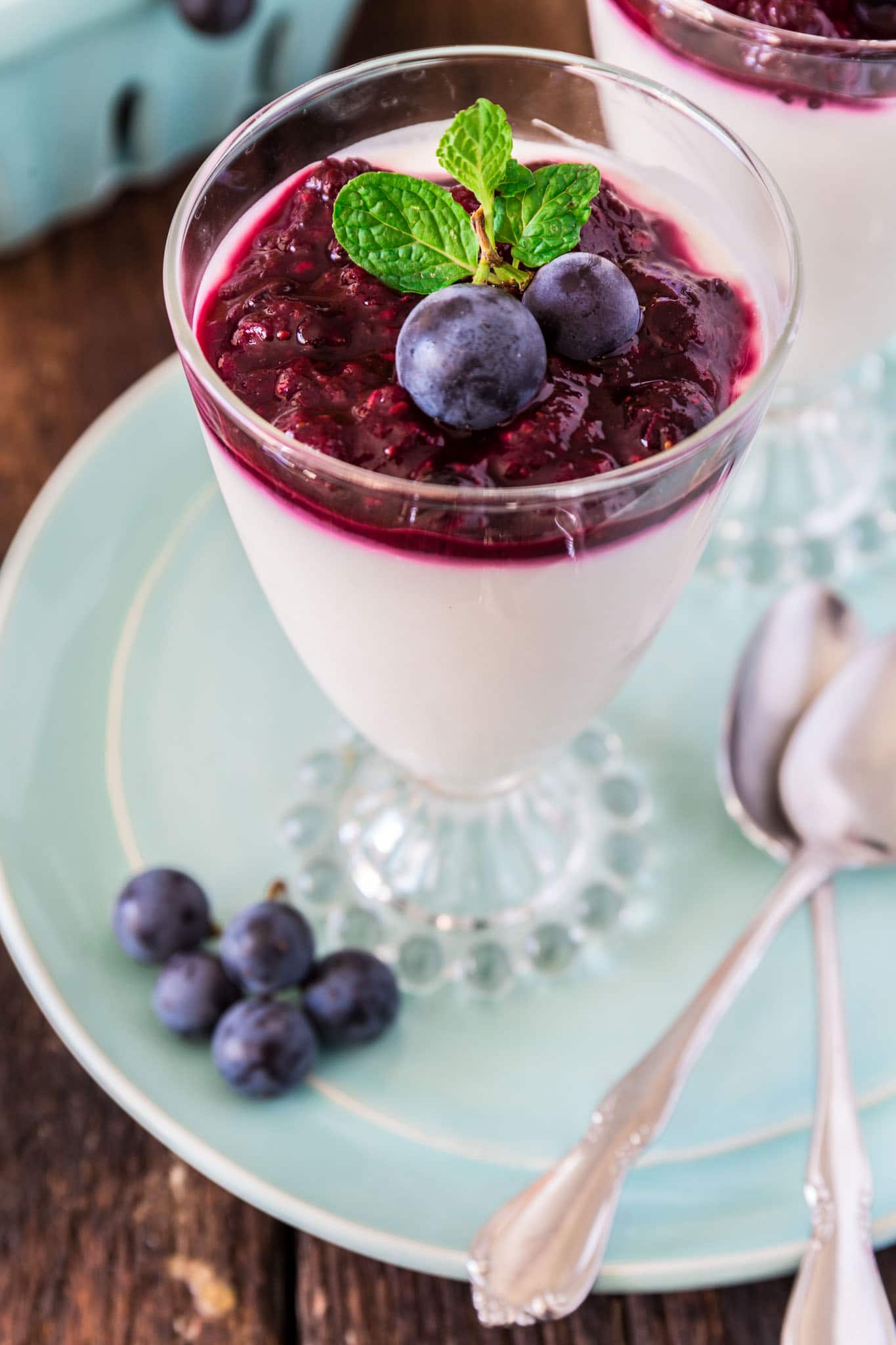 Yogurt Panna Cotta with Grape and Berry Compote | www.oliviascuisine.com | This lighter version of the classic panna cotta is made with greek yogurt instead of cream, so it won't ruin your diet! (Recipe and food photography by @oliviascuisine.)
