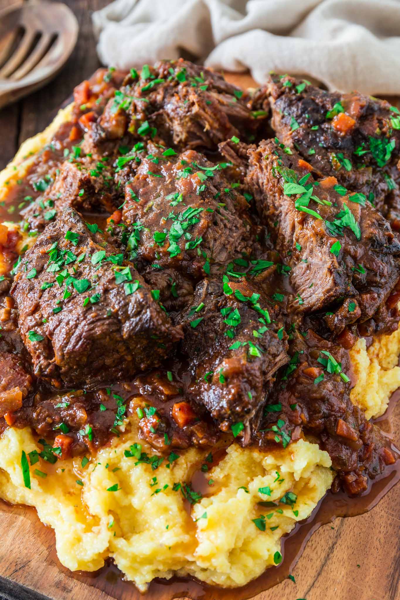 Italian Pot Roast (Stracotto alla Fiorentina) | www.oliviascuisine.com | Cold weather calls for comfort food, like this hearty and cozy Italian Pot Roast. It is made Tuscan style, simmering for hours in a delicious tomato sauce to ensure deep rich flavors while filling your home with the most amazing smells! (Recipe and food photography by @oliviascuisine.)