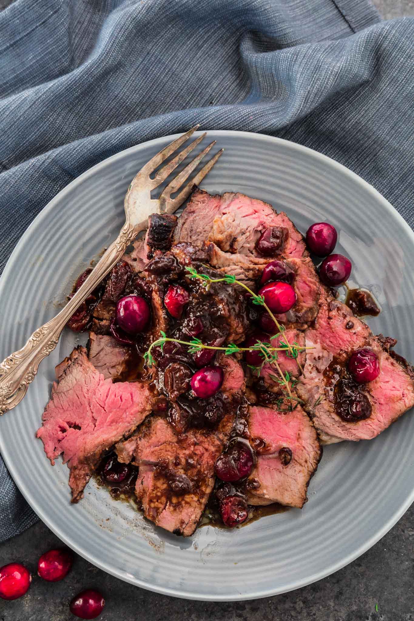 Cranberry Balsamic Roast Beef | www.oliviascuisine.com | This holiday season, impress your guests with this delicious Cranberry Balsamic Roast Beef! A little tangy, a little sweet and a whole lot of mouthwatering. Perfect to feed a crowd!