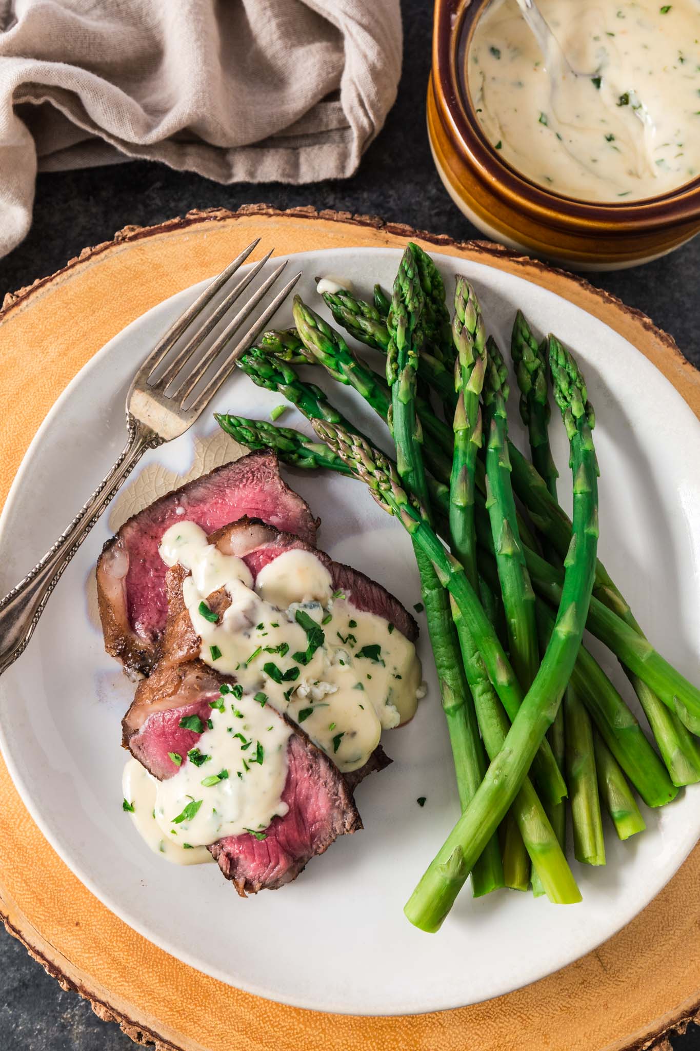 Pan Seared New York Strip Steak with Gorgonzola Sauce | www.oliviascuisine.com | No need to go to a steakhouse to enjoy a juicy New York Strip Steak, cooked to perfection. Follow my tips and you can make a superb steak dinner right at home, on your stove, in less than 30 minutes! The buttery Gorgonzola Cream Sauce is optional, but you'd be crazy to skip it. (Recipe and food photography by @oliviascuisine.)