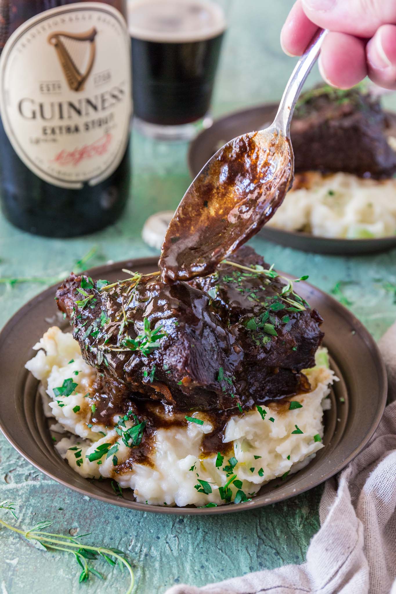 Stout Beer Braised Short Ribs | www.oliviascuisine.com | Celebrate St. Patrick's Day by cooking these Irish inspired Stout Beer Braised Short Ribs. Rich, hearty and incredibly fall-apart tender! Serve it over colcannon or with some Irish soda bread to soak up all that luscious beer gravy goodness. (Recipe and food photography by @oliviascuisine.)