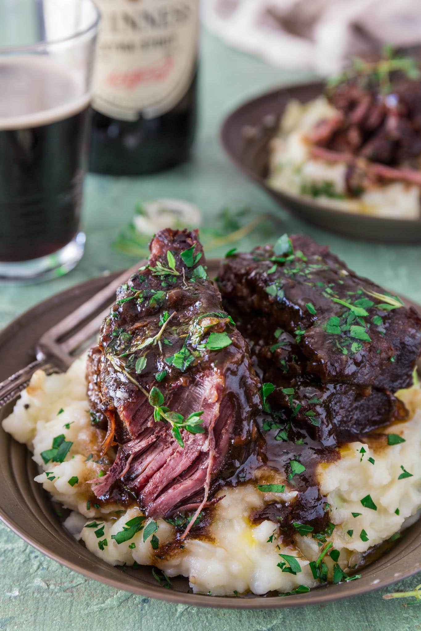 Stout Beer Braised Short Ribs | www.oliviascuisine.com | Celebrate St. Patrick's Day by cooking these Irish inspired Stout Beer Braised Short Ribs. Rich, hearty and incredibly fall-apart tender! Serve it over colcannon or with some Irish soda bread to soak up all that luscious beer gravy goodness. (Recipe and food photography by @oliviascuisine.)