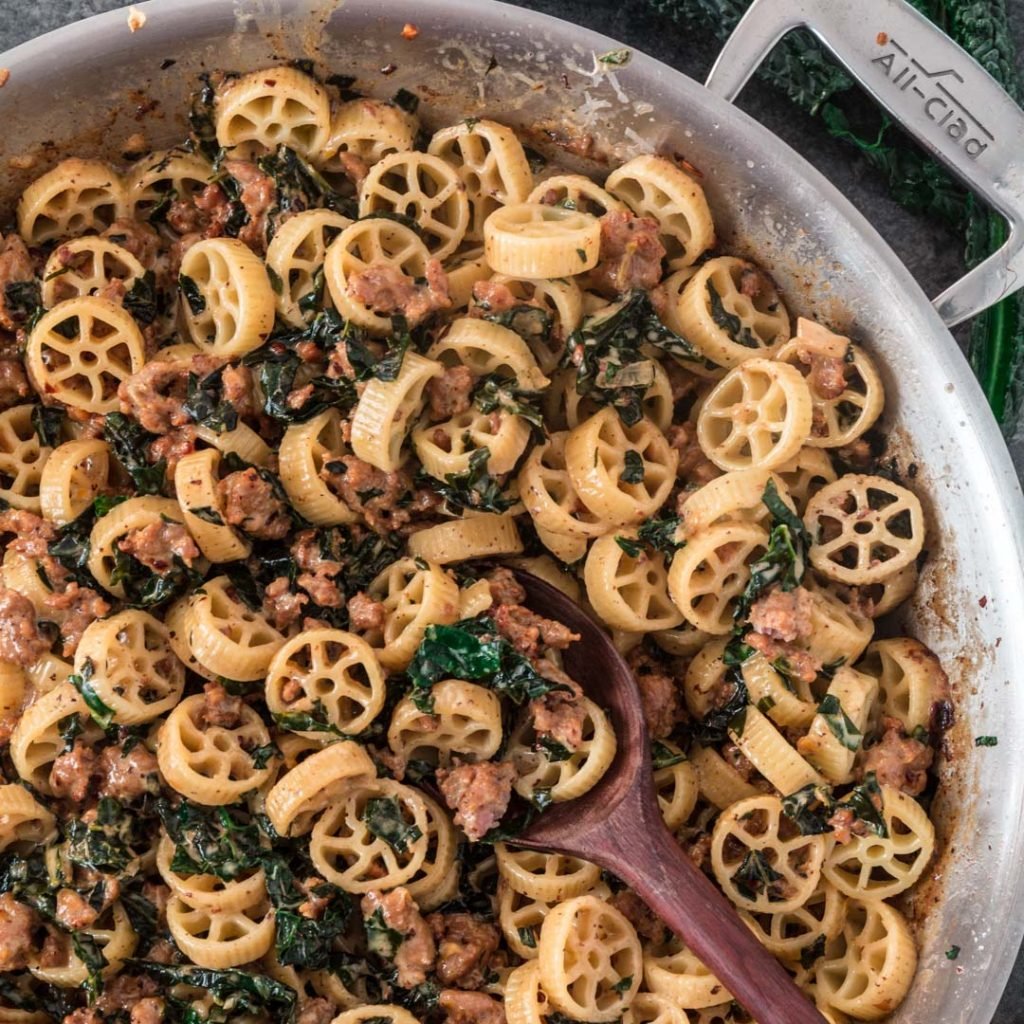 Creamy Sausage Kale Pasta | www.oliviascuisine.com | Possibly my favorite pasta dish, this Creamy Sausage Kale Pasta combines Italian sausage with rich and earthy Tuscan Kale. Tossed in the creamiest lemon parmesan sauce! And you can make it as mild or as spicy as you like! (Recipe and food photography by @oliviascuisine.)