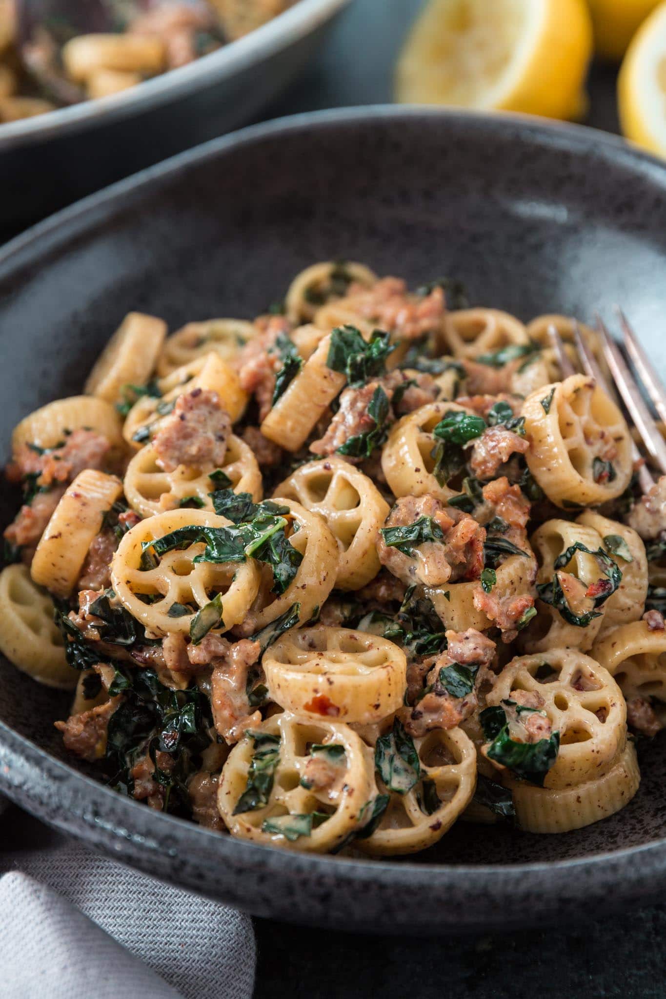 Creamy Sausage Kale Pasta | www.oliviascuisine.com | Possibly my favorite pasta dish, this Creamy Sausage Kale Pasta combines Italian sausage with rich and earthy Tuscan Kale. Tossed in the creamiest lemon parmesan sauce! And you can make it as mild or as spicy as you like! (Recipe and food photography by @oliviascuisine.)