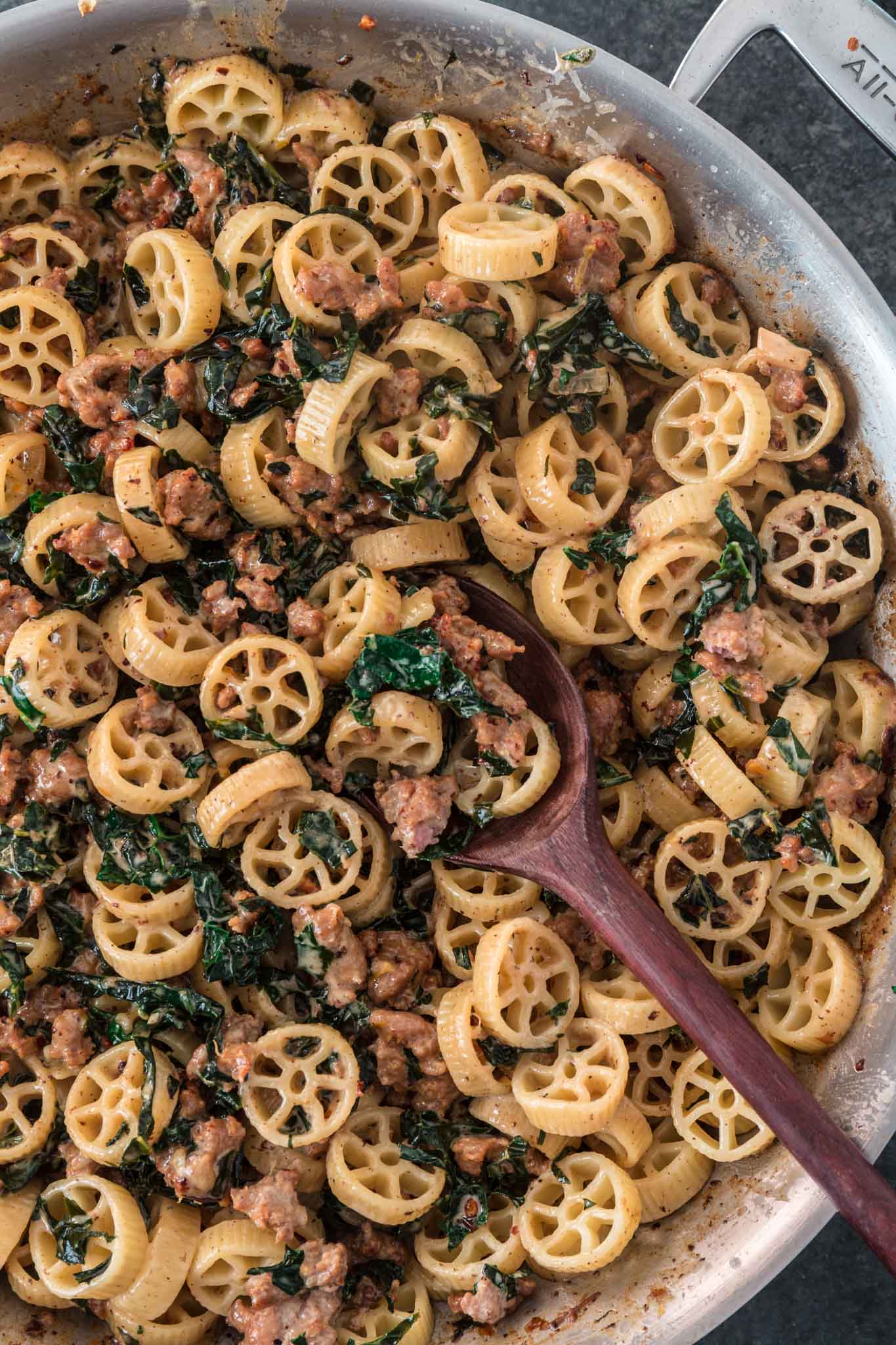 Creamy Sausage Kale Pasta | www.oliviascuisine.com | Possibly my favorite pasta dish, this Creamy Sausage Kale Pasta combines Italian sausage with rich and earthy Tuscan Kale. Tossed in the creamiest lemon parmesan sauce! And you can make it as mild or as spicy as you like! (Recipe and food photography by @oliviascuisine.)