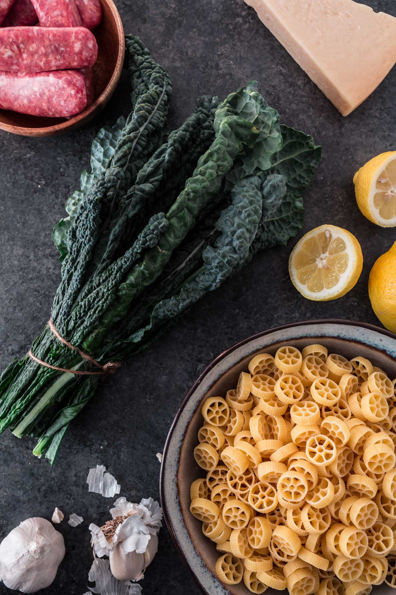 Creamy Sausage Kale Pasta | www.oliviascuisine.com | Possibly my favorite pasta dish, this Creamy Sausage Kale Pasta combines Italian sausage with rich and earthy Tuscan Kale. Tossed in the creamiest lemon parmesan sauce! And you can make it as mild or as spicy as you like! (Recipe and food photography by @oliviascuisine.)