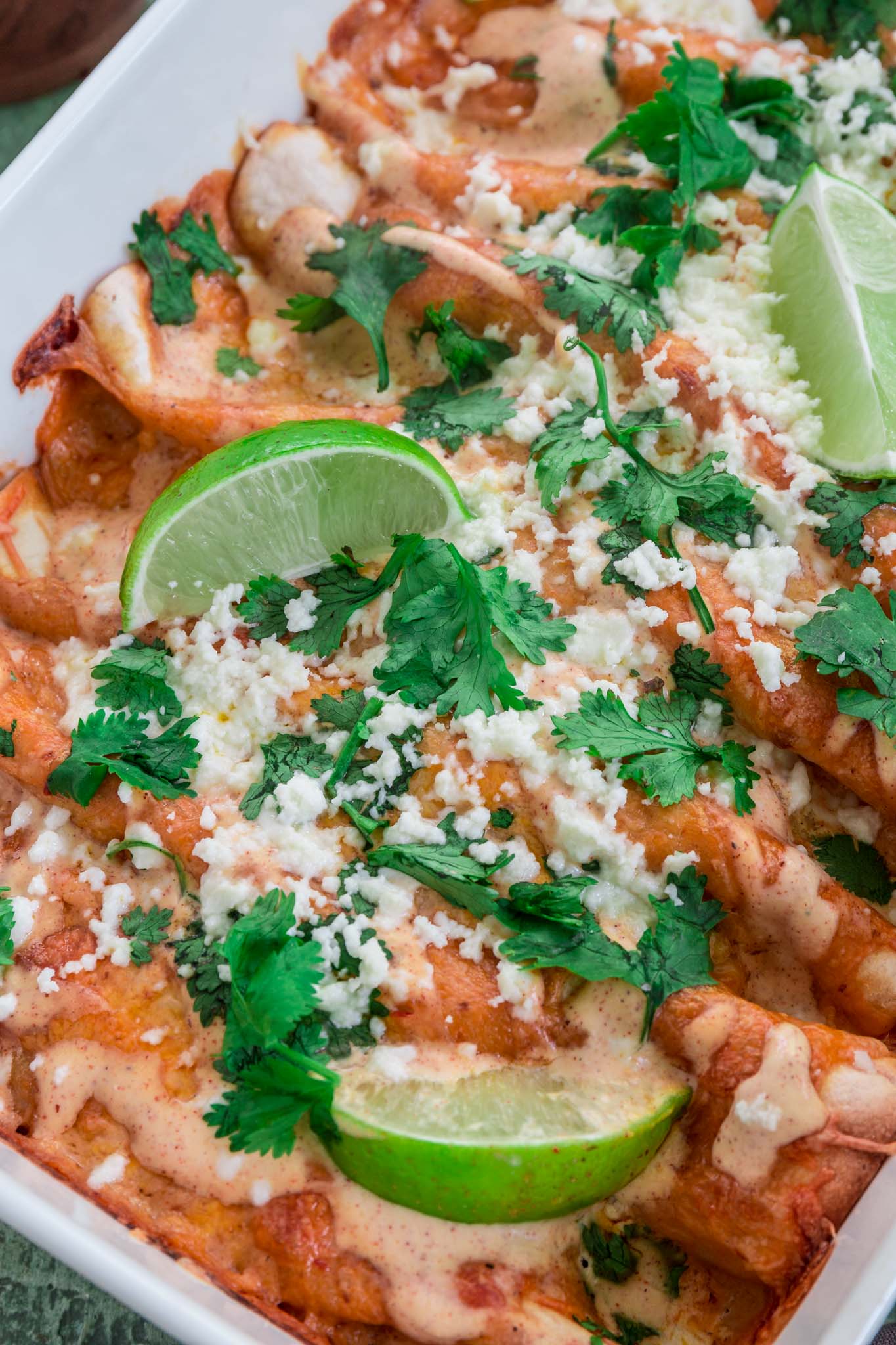 Chicken and Chorizo Enchiladas with Chipotle Crema Sauce | www.oliviascuisine.com | If you like it hot, these Chicken and Chorizo Enchiladas are for you! Spicy, delicious, and smothered with the creamiest Chipotle Crema Sauce. They will knock your socks off! (Recipe and food photography by @oliviascuisine.)