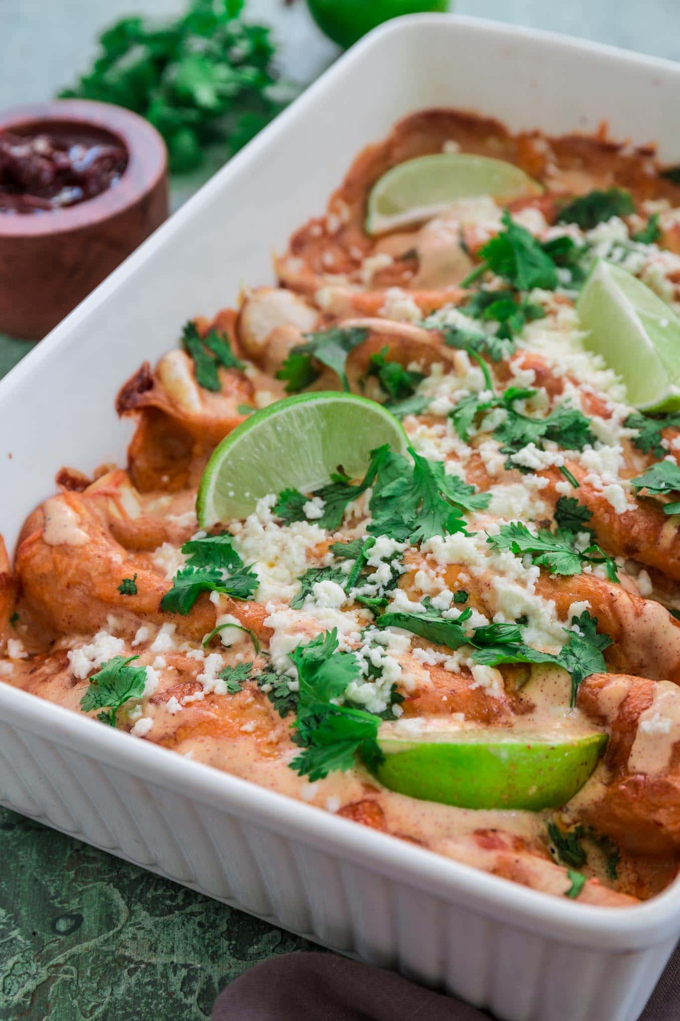 Chicken and Chorizo Enchiladas with Chipotle Crema Sauce | www.oliviascuisine.com | If you like it hot, these Chicken and Chorizo Enchiladas are for you! Spicy, delicious, and smothered with the creamiest Chipotle Crema Sauce. They will knock your socks off! (Recipe and food photography by @oliviascuisine.)