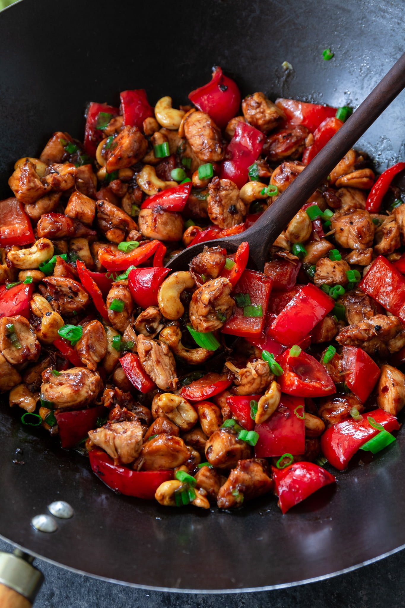 Meal Prep Cashew Chicken | www.oliviascuisine.com | Who needs takeout when you can cook delicious Cashew Chicken at home? Tender chicken, scallions and peppers coated in a rich, sweet sauce and topped with crunchy cashews. I can't get enough of it! (Recipe and food photography by @oliviascuisine.)