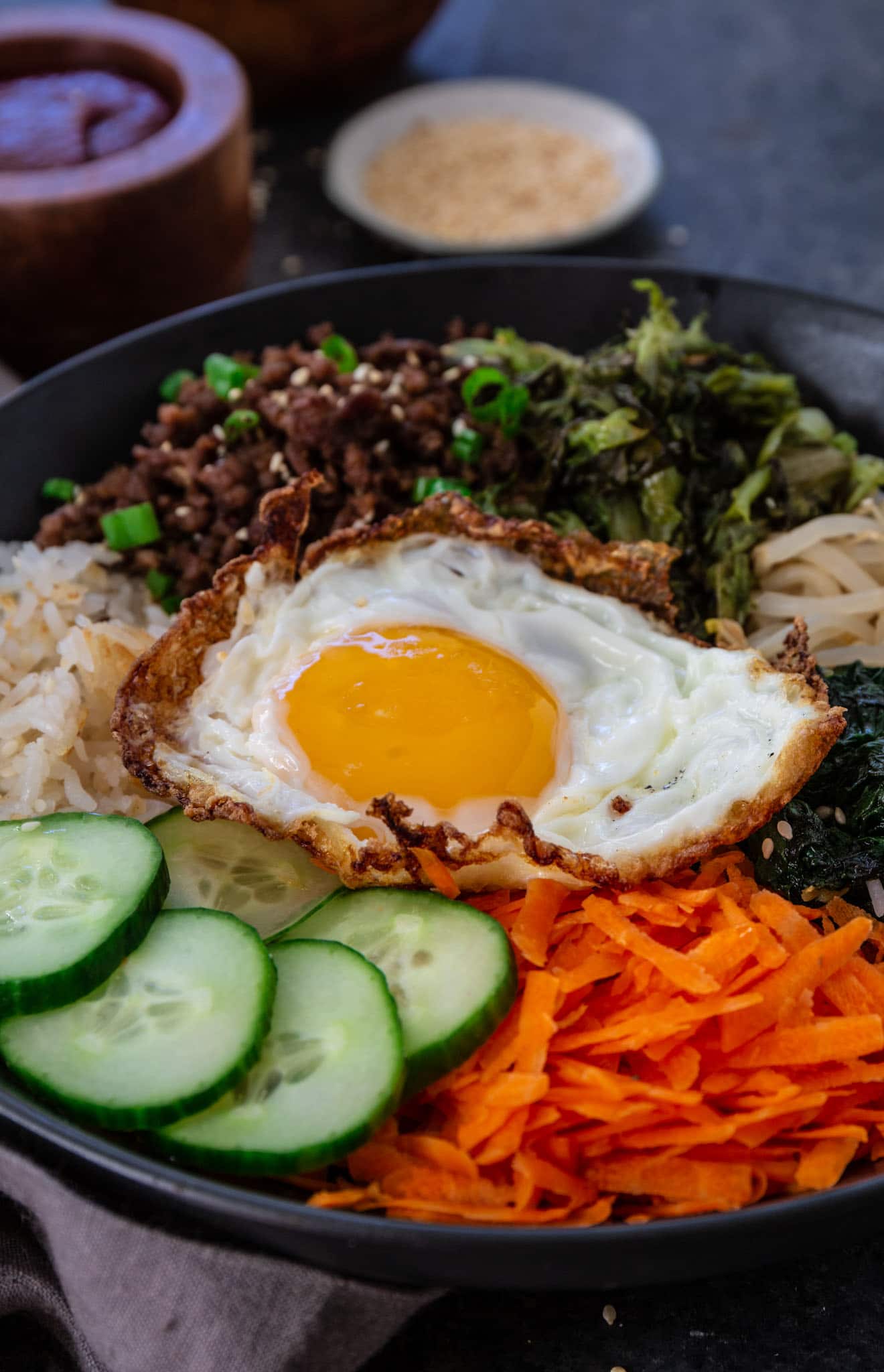 Bibimbap (Korean Beef Rice Bowl) | www.oliviascuisine.com | My version of Bibimbap, a popular Korean rice dish, takes a few shortcuts for convenience! The good news is that it’s done in less than 30 minutes without compromising flavor. Serve with a fried egg on top for that extra wow factor! (Recipe and food photography by @oliviascuisine.)
