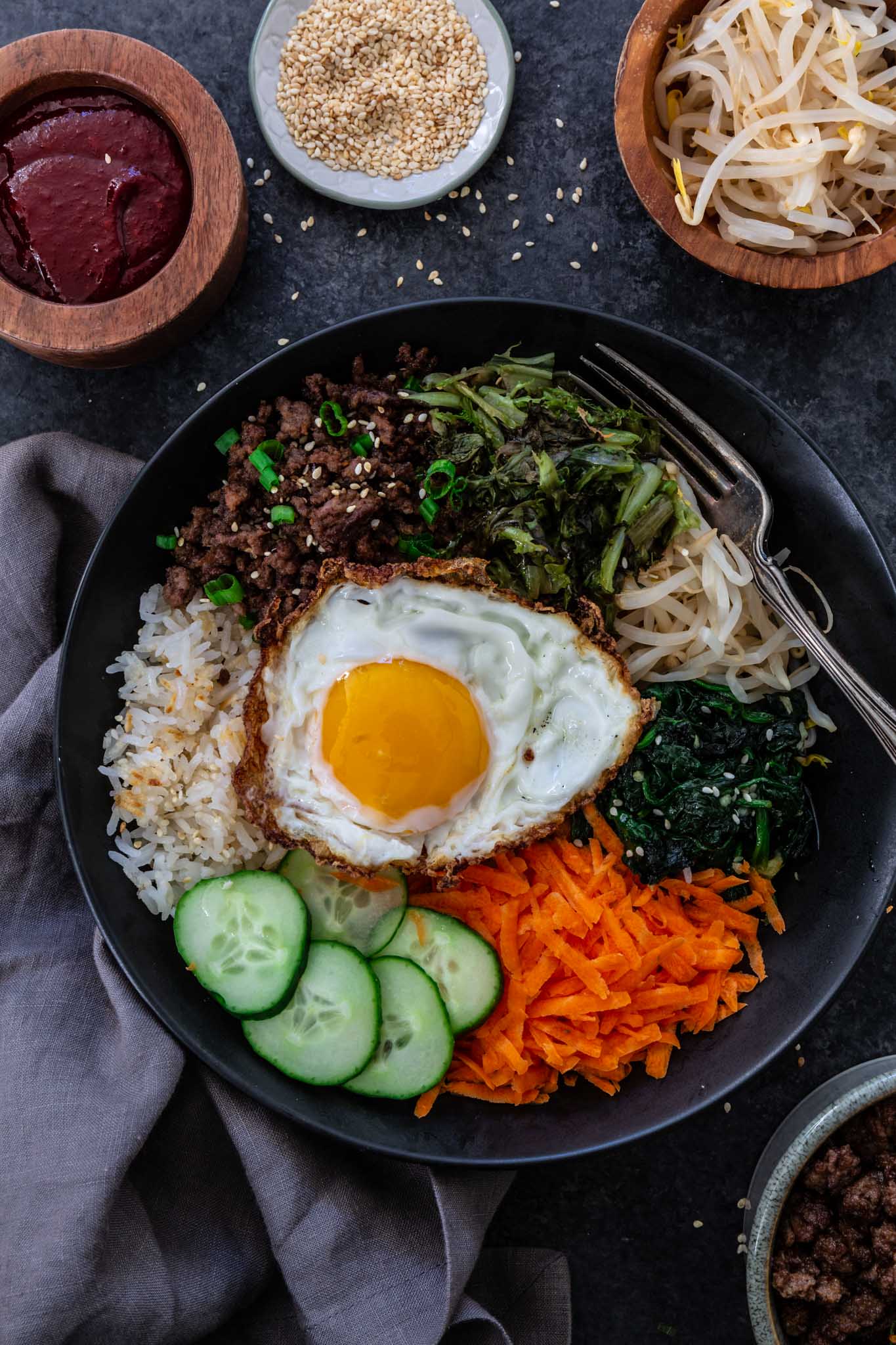 Bibimbap (Korean Beef Rice Bowl) | www.oliviascuisine.com | My version of Bibimbap, a popular Korean rice dish, takes a few shortcuts for convenience! The good news is that it’s done in less than 30 minutes without compromising flavor. Serve with a fried egg on top for that extra wow factor! (Recipe and food photography by @oliviascuisine.)