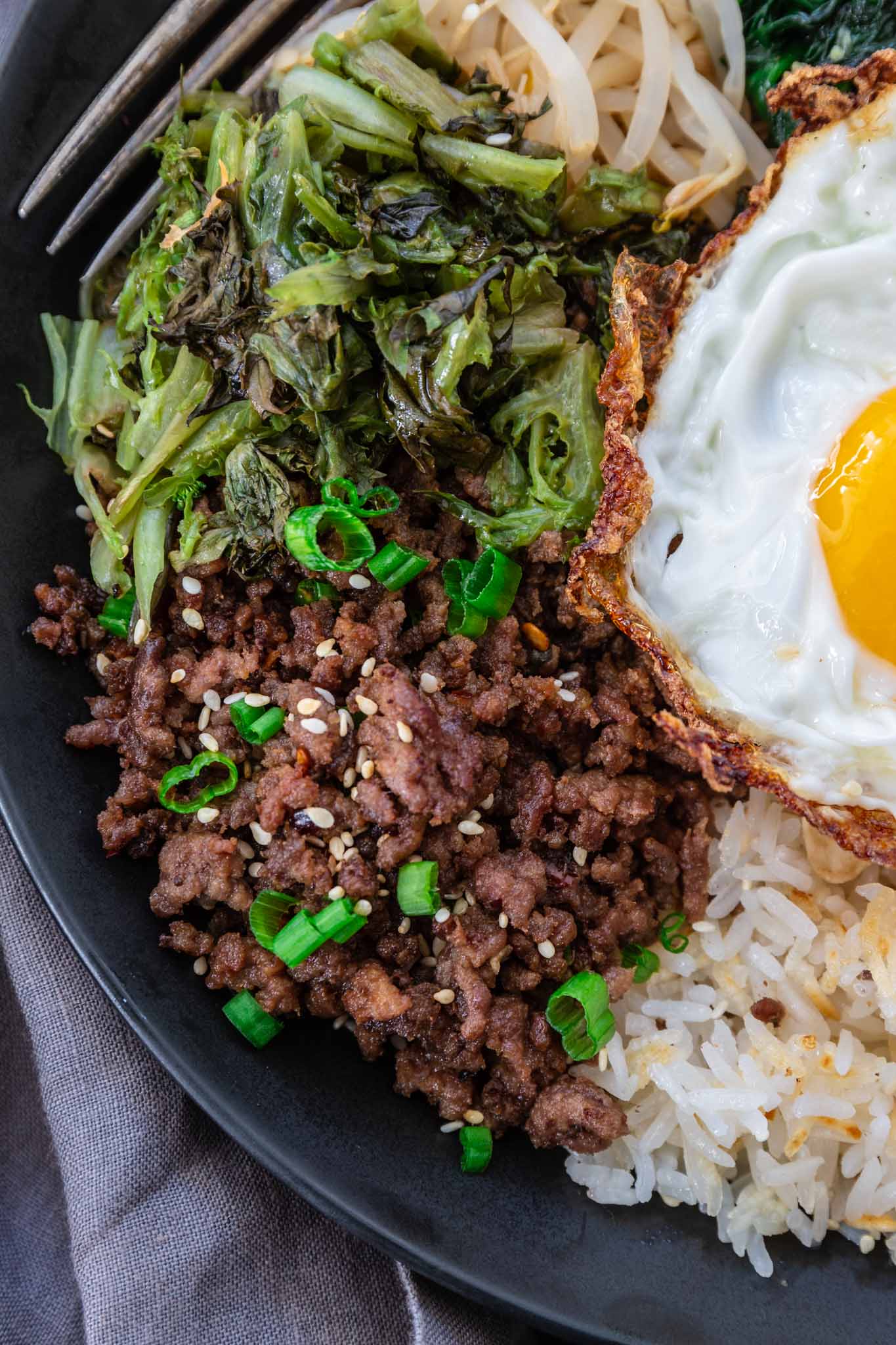 Bibimbap (Korean Beef Rice Bowl) | www.oliviascuisine.com | My version of Bibimbap, a popular Korean rice dish, takes a few shortcuts for convenience! The good news is that it’s done in less than 30 minutes without compromising flavor. Serve with a fried egg on top for that extra wow factor! (Recipe and food photography by @oliviascuisine.)