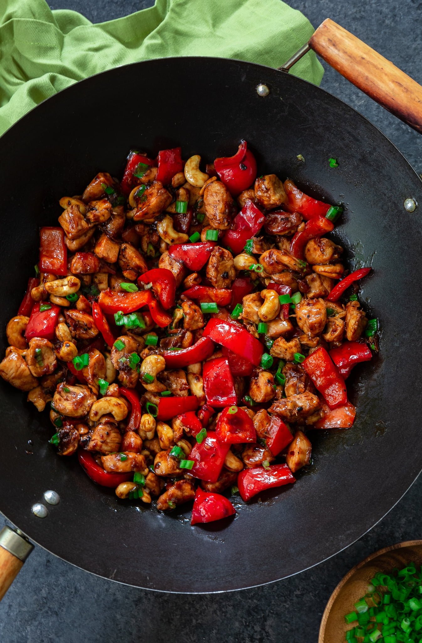 Meal Prep Cashew Chicken | www.oliviascuisine.com | Who needs takeout when you can cook delicious Cashew Chicken at home? Tender chicken, scallions and peppers coated in a rich, sweet sauce and topped with crunchy cashews. I can't get enough of it! (Recipe and food photography by @oliviascuisine.)