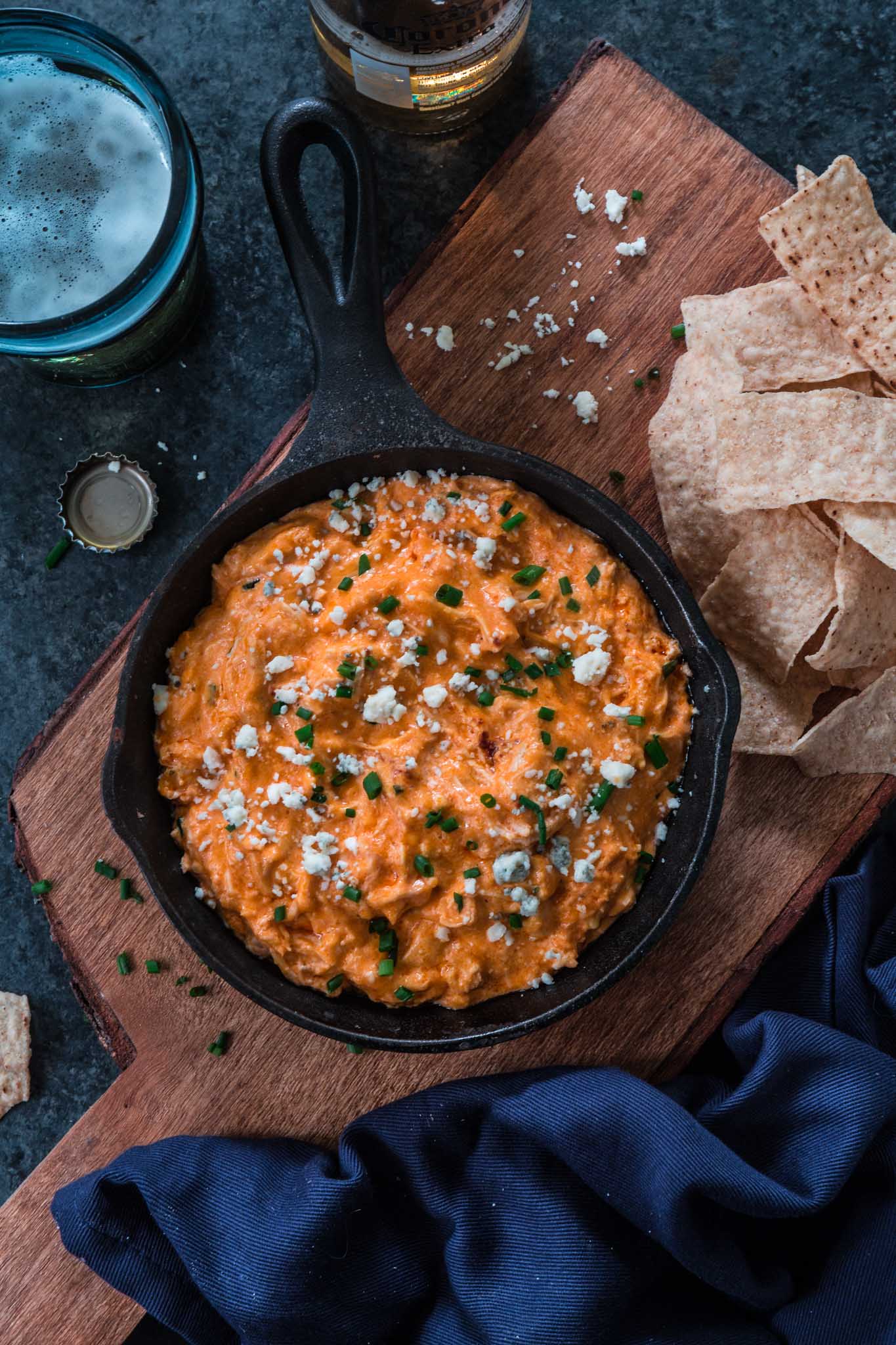 Slow Cooker Buffalo Chicken Dip | www.oliviascuisine.com | Get ready for football season with this easy and delicious Buffalo Chicken Dip! Made in the slow cooker and served hot with your favorite topping and tortilla chips. What could be better than that? (Recipe and food photography by @oliviascuisine.)