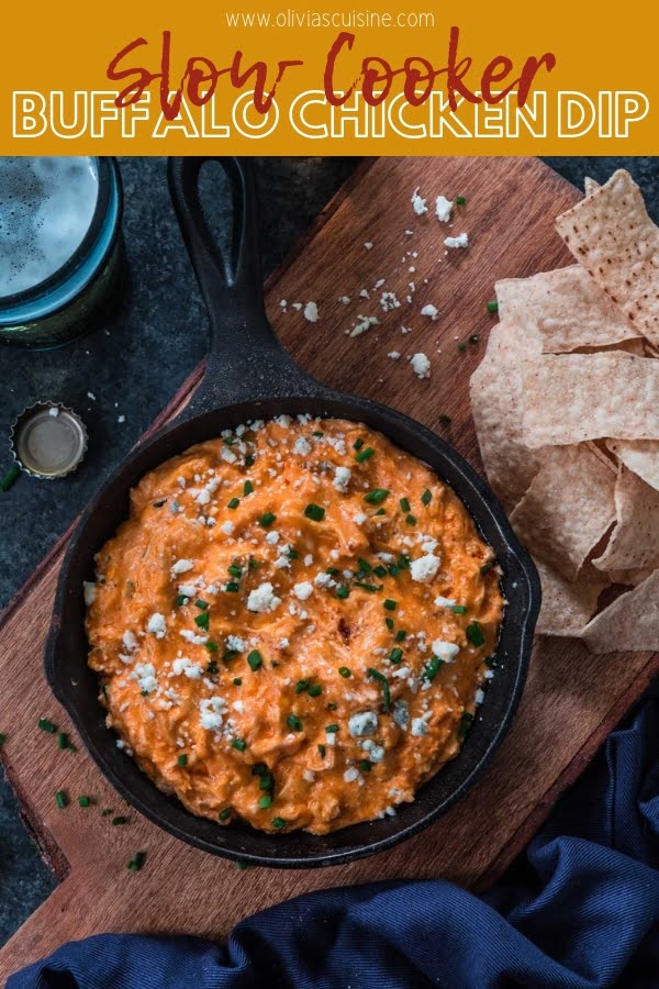 Slow Cooker Buffalo Chicken Dip | www.oliviascuisine.com | Get ready for football season with this easy and delicious Buffalo Chicken Dip! Made in the slow cooker and served hot with your favorite topping and tortilla chips. What could be better than that? (Recipe and food photography by @oliviascuisine.)