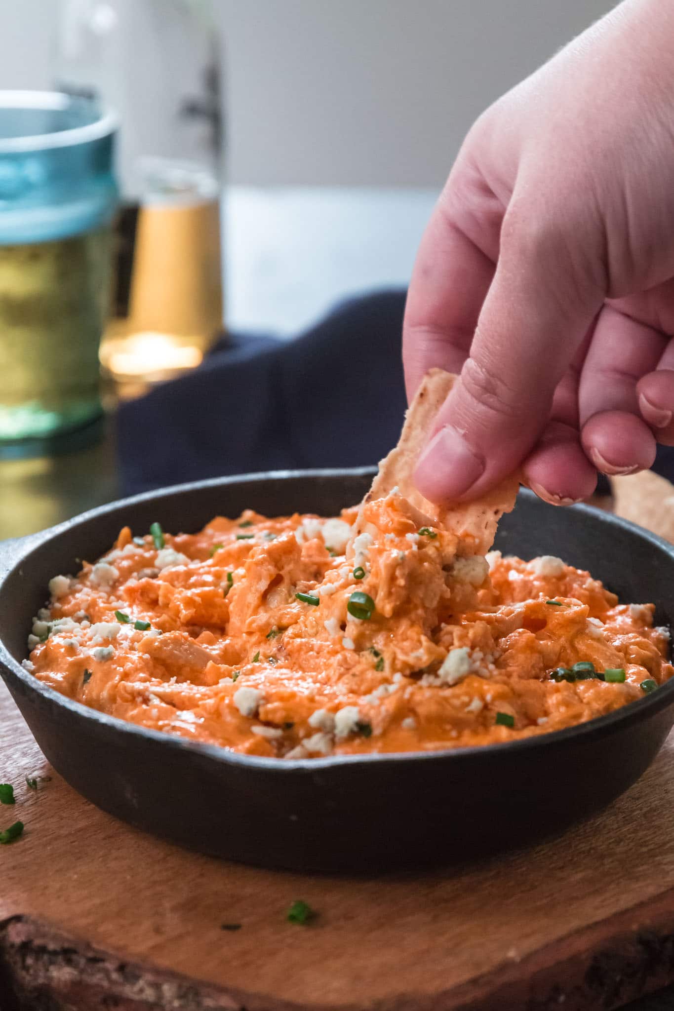 Slow Cooker Buffalo Chicken Dip | www.oliviascuisine.com | Get ready for football season with this easy and delicious Buffalo Chicken Dip! Made in the slow cooker and served hot with your favorite topping and tortilla chips. What could be better than that? (Recipe and food photography by @oliviascuisine.)