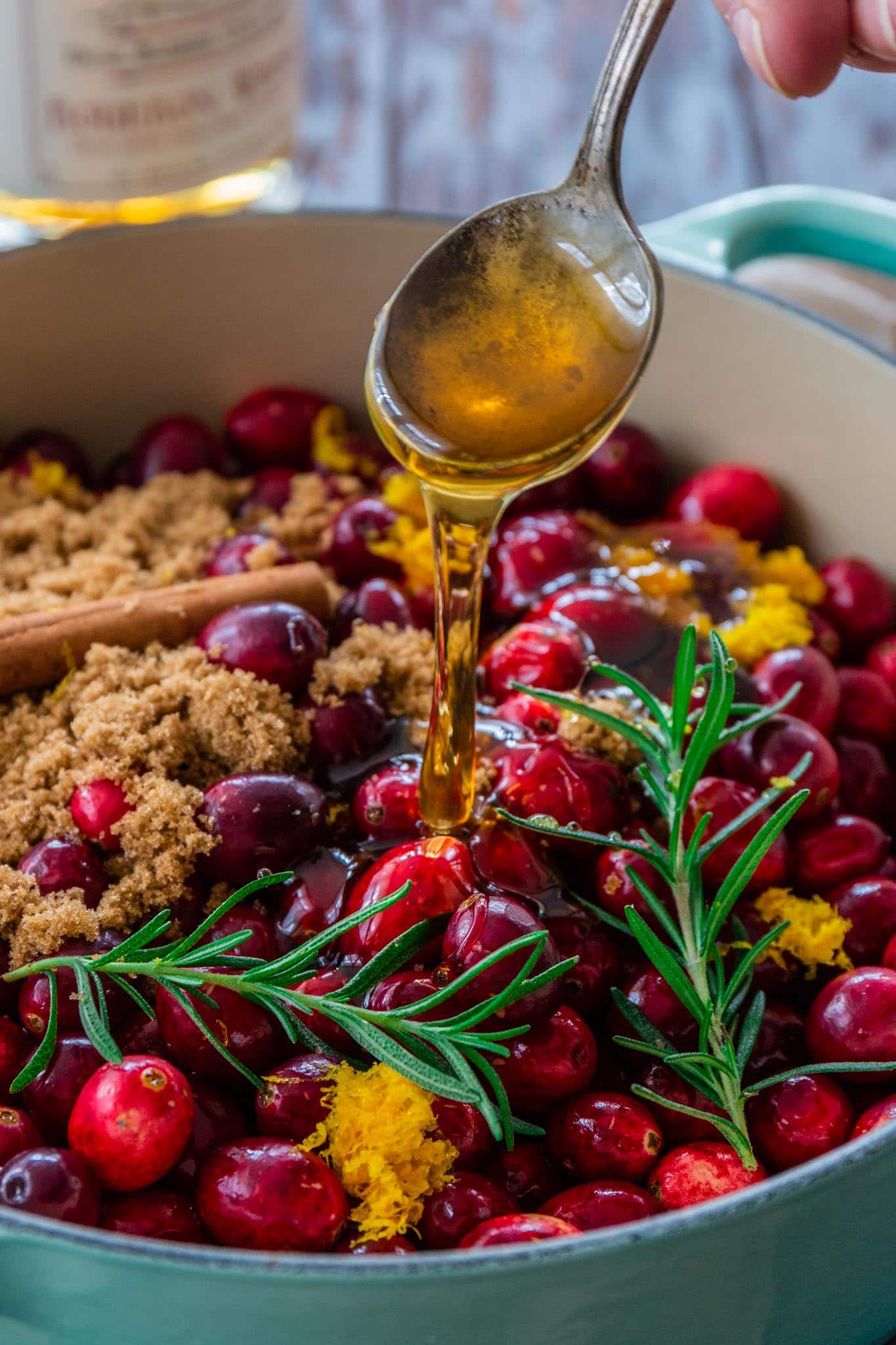 Honey Bourbon Cranberry Sauce | www.oliviascuisine.com | This Honey Bourbon Cranberry Sauce might steal the show this Thanksgiving! Sweet, tart, chunky and so easy to make. You will never buy the canned stuff again! (Recipe and food photography by @oliviascuisine.)