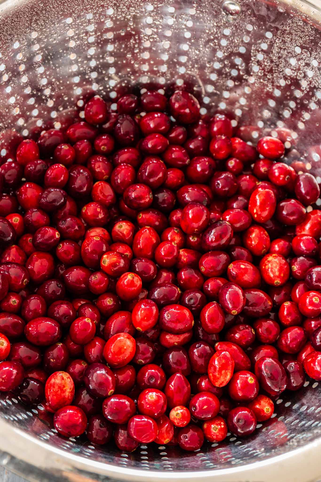 Honey Bourbon Cranberry Sauce | www.oliviascuisine.com | This Honey Bourbon Cranberry Sauce might steal the show this Thanksgiving! Sweet, tart, chunky and so easy to make. You will never buy the canned stuff again! (Recipe and food photography by @oliviascuisine.)