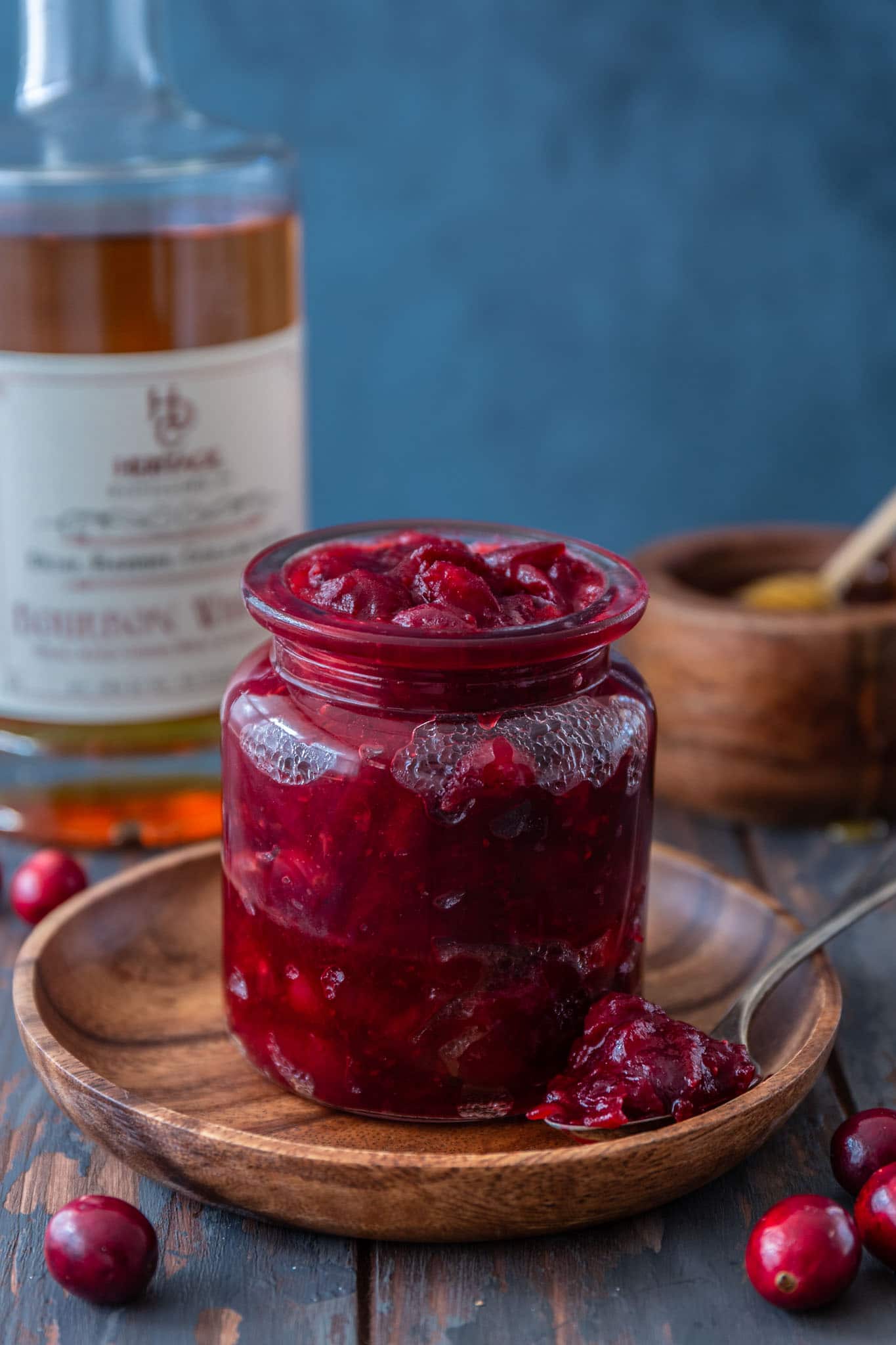 Honey Bourbon Cranberry Sauce | www.oliviascuisine.com | This Honey Bourbon Cranberry Sauce might steal the show this Thanksgiving! Sweet, tart, chunky and so easy to make. You will never buy the canned stuff again! (Recipe and food photography by @oliviascuisine.)