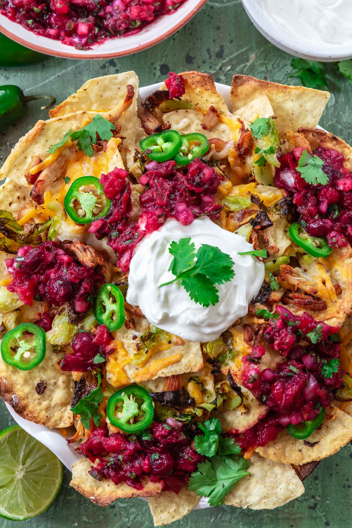 Thanksgiving Leftover Turkey Nachos | www.oliviascuisine.com | If you're looking for a way to use all that leftover turkey from Thanksgiving, these Leftover Turkey Nachos might be just what you need! Crispy Mission® Triangles Tortilla Chips topped with turkey carnitas, cranberry sauce salsa, Brussels sprouts and lots of cheese. Oh, it doesn't get better than that!