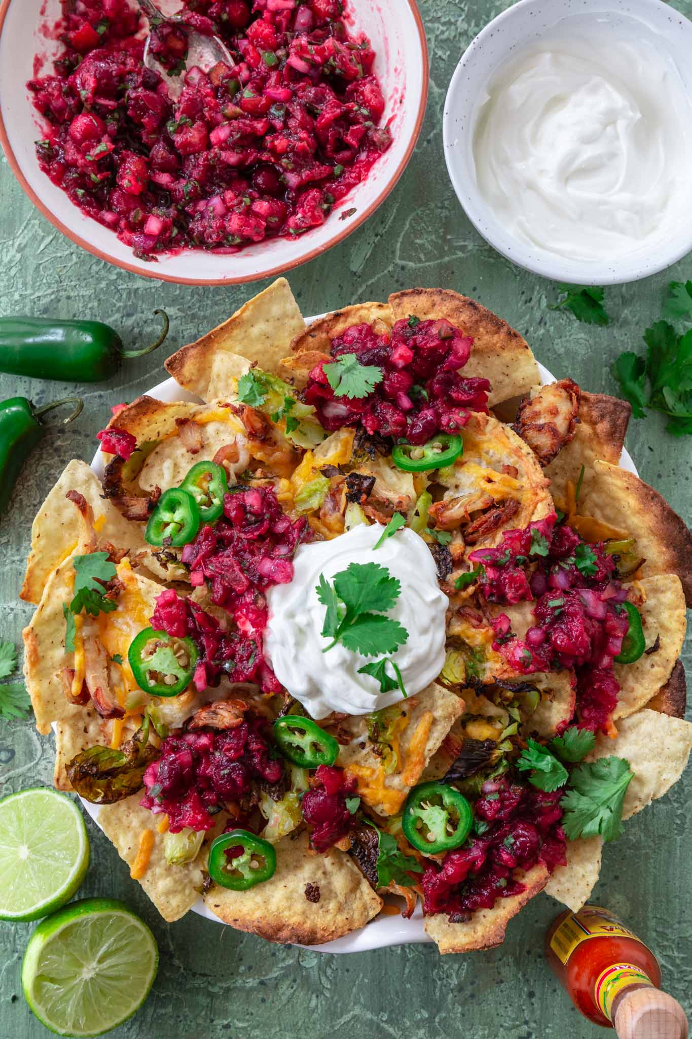 Thanksgiving Leftover Turkey Nachos | www.oliviascuisine.com | If you're looking for a way to use all that leftover turkey from Thanksgiving, these Leftover Turkey Nachos might be just what you need! Crispy Mission® Triangles Tortilla Chips topped with turkey carnitas, cranberry sauce salsa, Brussels sprouts and lots of cheese. Oh, it doesn't get better than that!